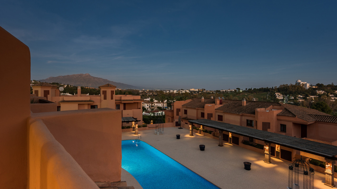 Andalusian pueblo- style one, two, and three- bedroom suites within a private resort in El Paraiso