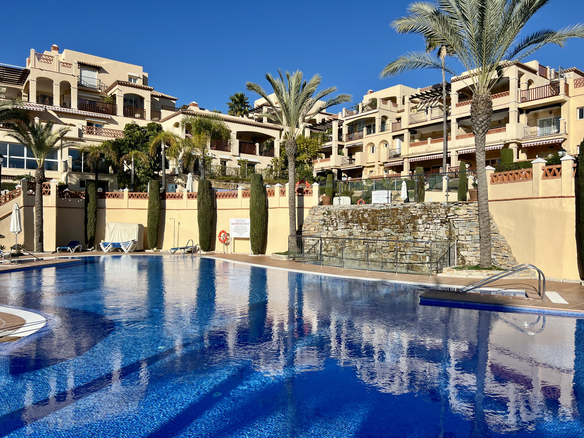 Spacious ground floor apartment located in a front line golf luxury gated community on Atalaya Golf.