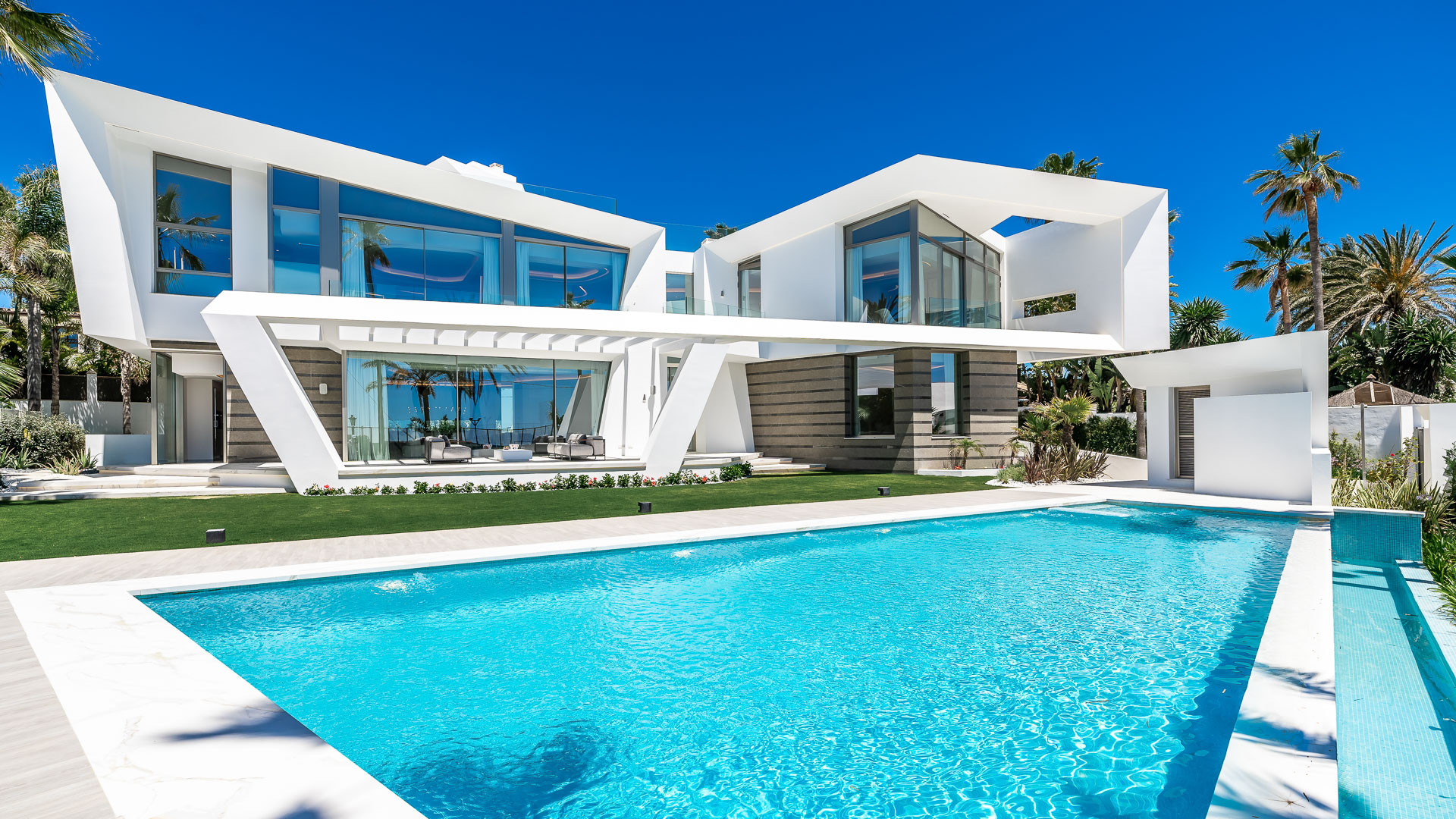 Qlistings - Custom designed villa built with impeccable taste and direct beach access for sale in Los Monteros Playa, Marbella East Property Image