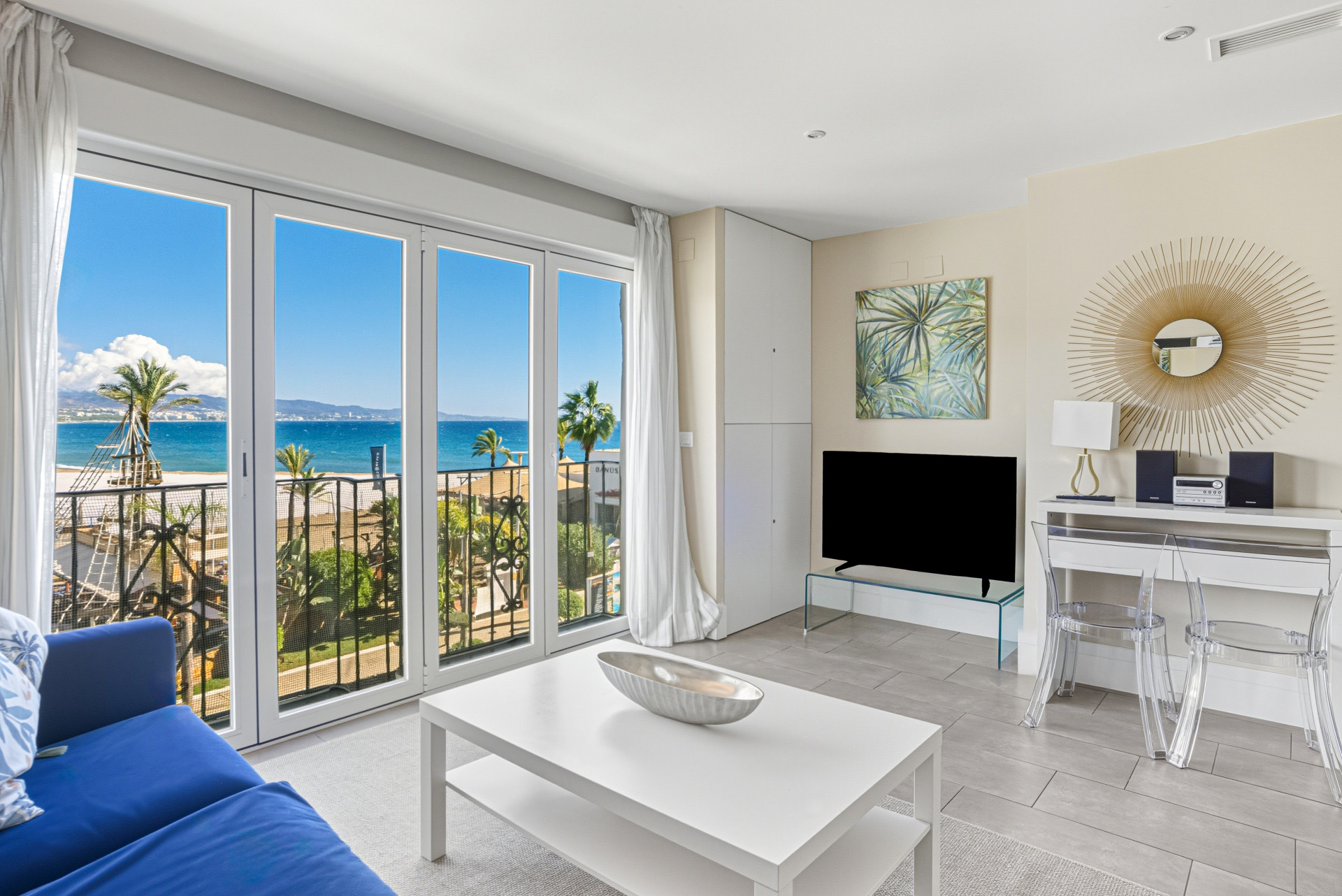 Two-bedroom, beachfront apartment with sea and mountain views, located in the heart of Puerto Banús.