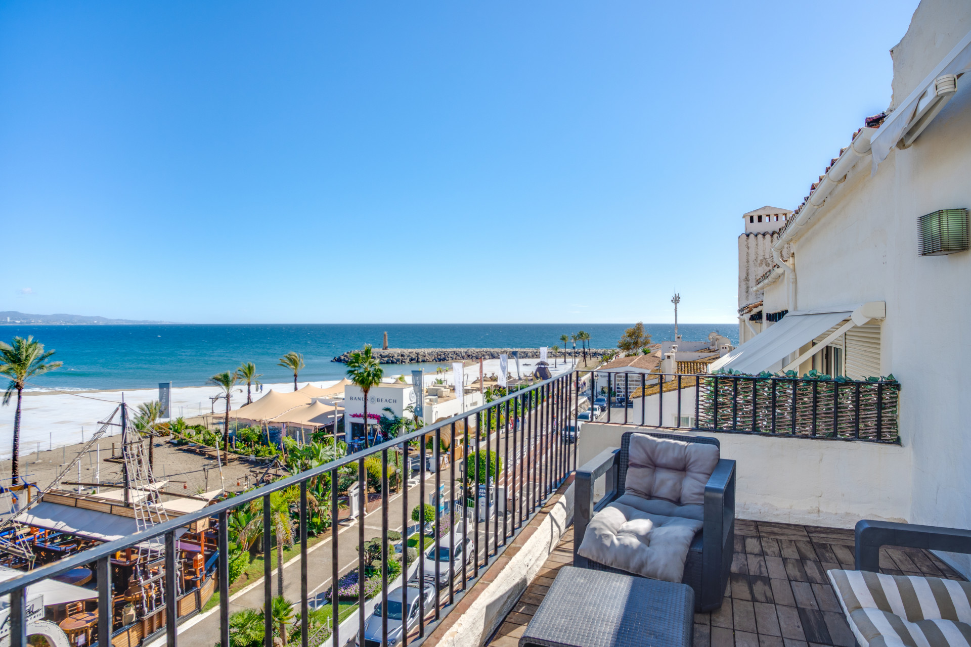 Beautiful beachfront penthouse with sea and mountain views, located in the heart of Puerto Banús.