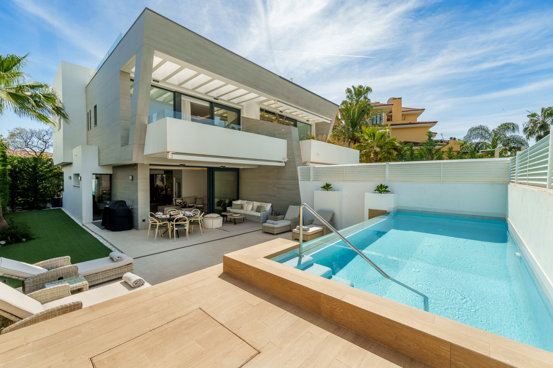 Beautiful modern five bedroom semi-detached villa located in the gated community of Banus Bay, Puerto Banus