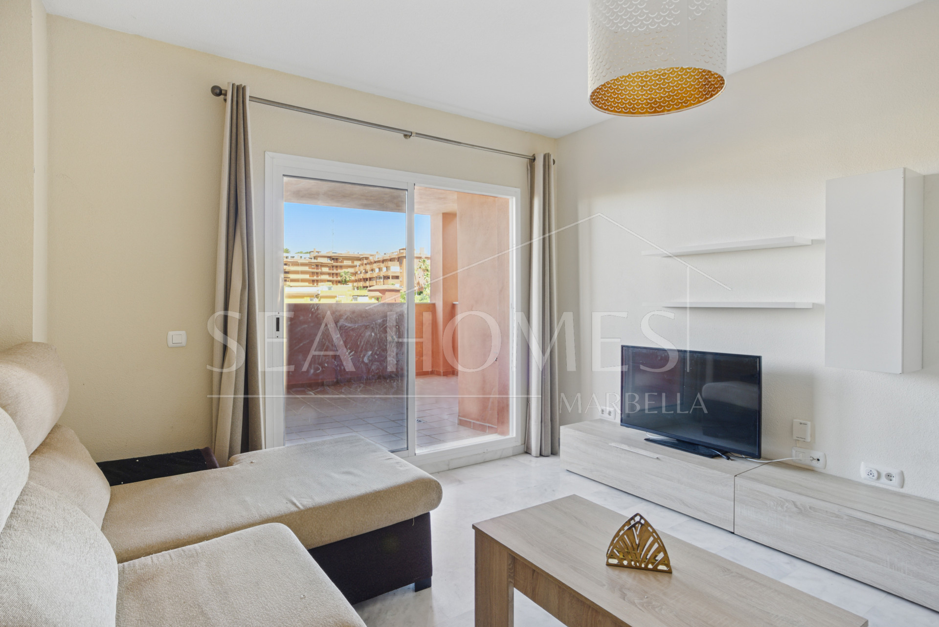 Lovely two bedroom, south west facing apartment in La Reserva de Marbella; with sea views