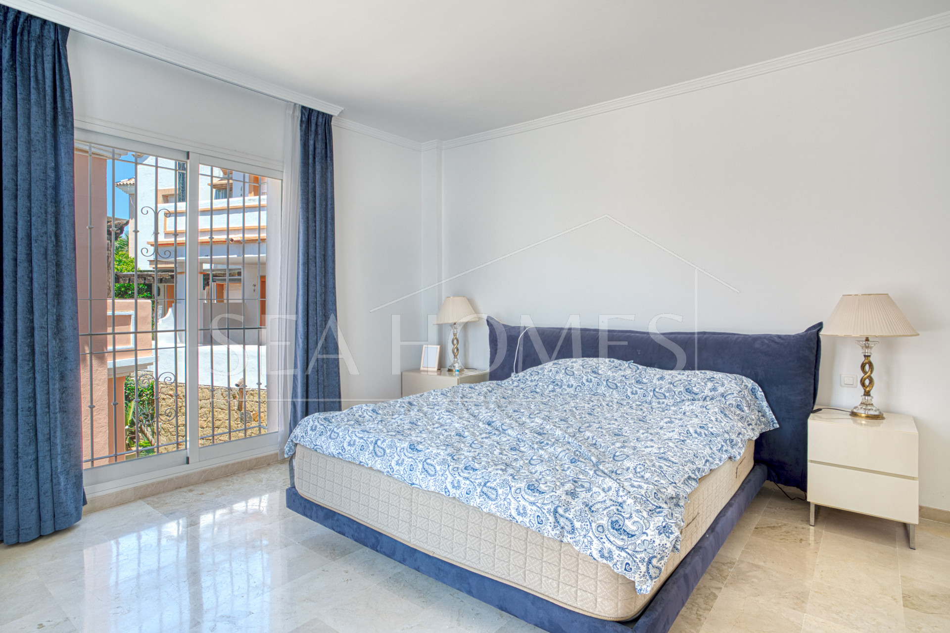 Elegant two bedroom, south west facing townhouse set within an exclusive gated community of Nueva Andalucia, Marbella