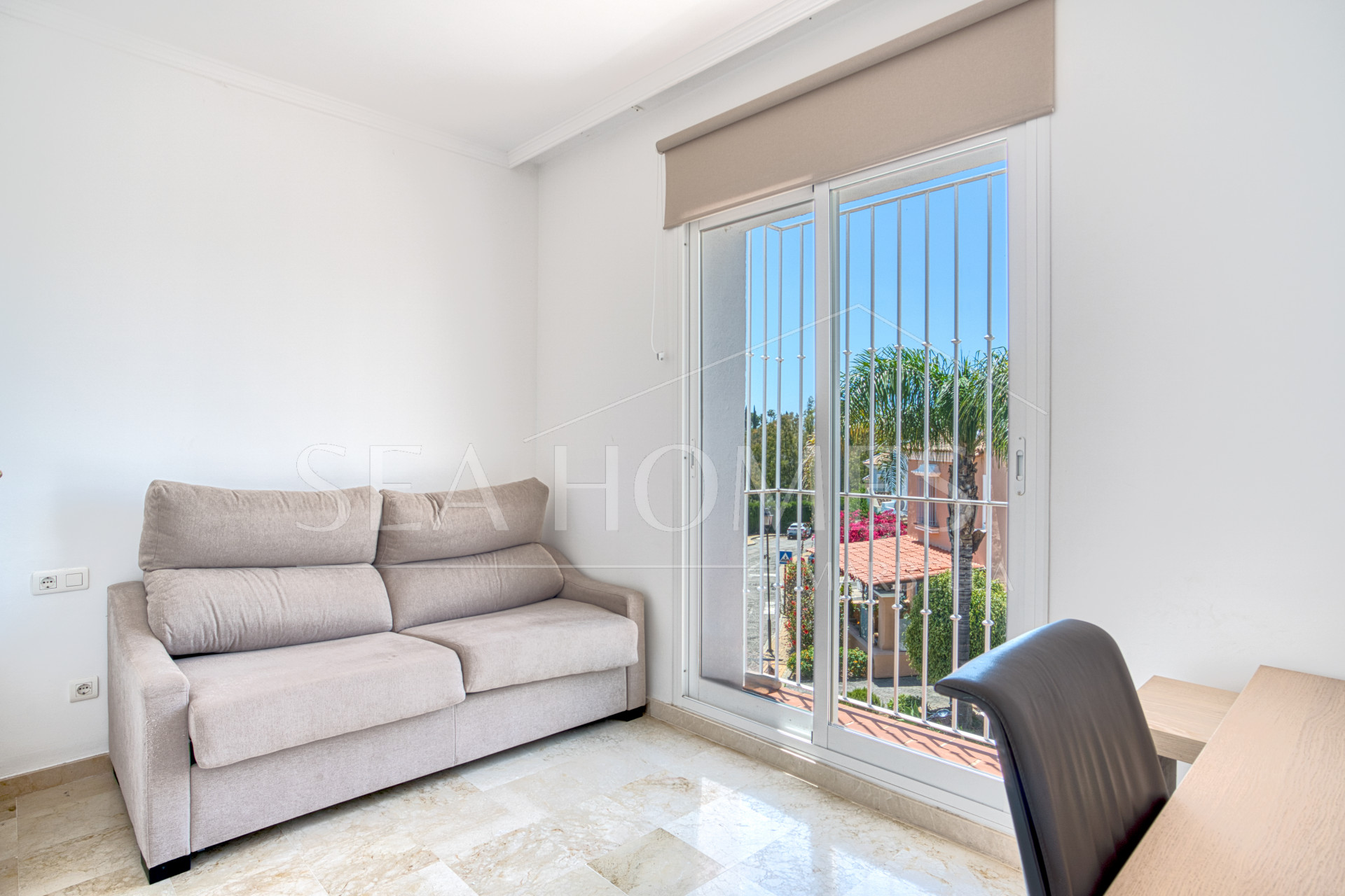 Elegant two bedroom, south west facing townhouse set within an exclusive gated community of Nueva Andalucia, Marbella
