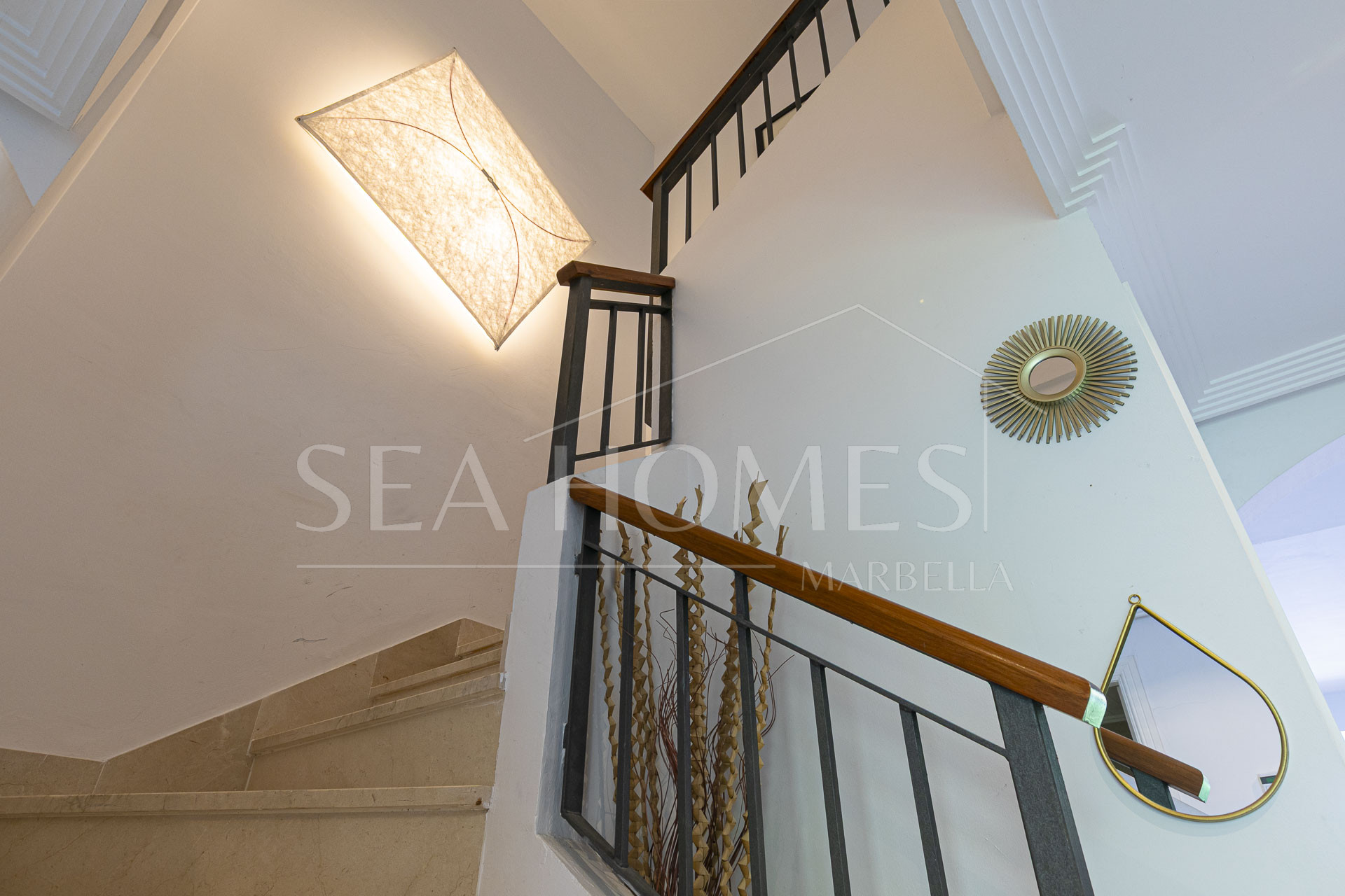 Beautiful south-facing, four bedroom townhouse in Los Almendros, part of the secure Los Arqueros Golf community in Benahavís