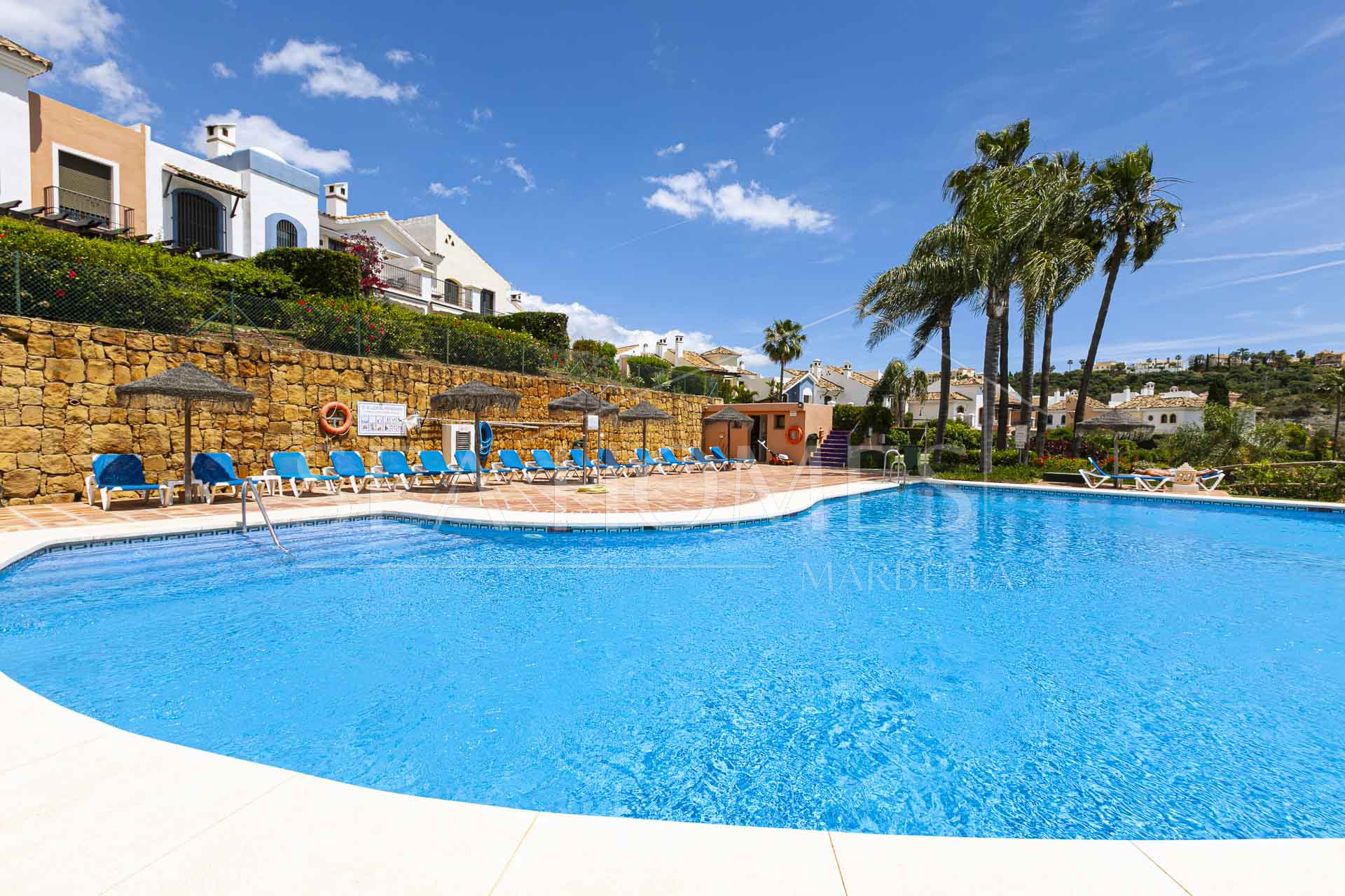 Beautiful south-facing, four bedroom townhouse in Los Almendros, part of the secure Los Arqueros Golf community in Benahavís