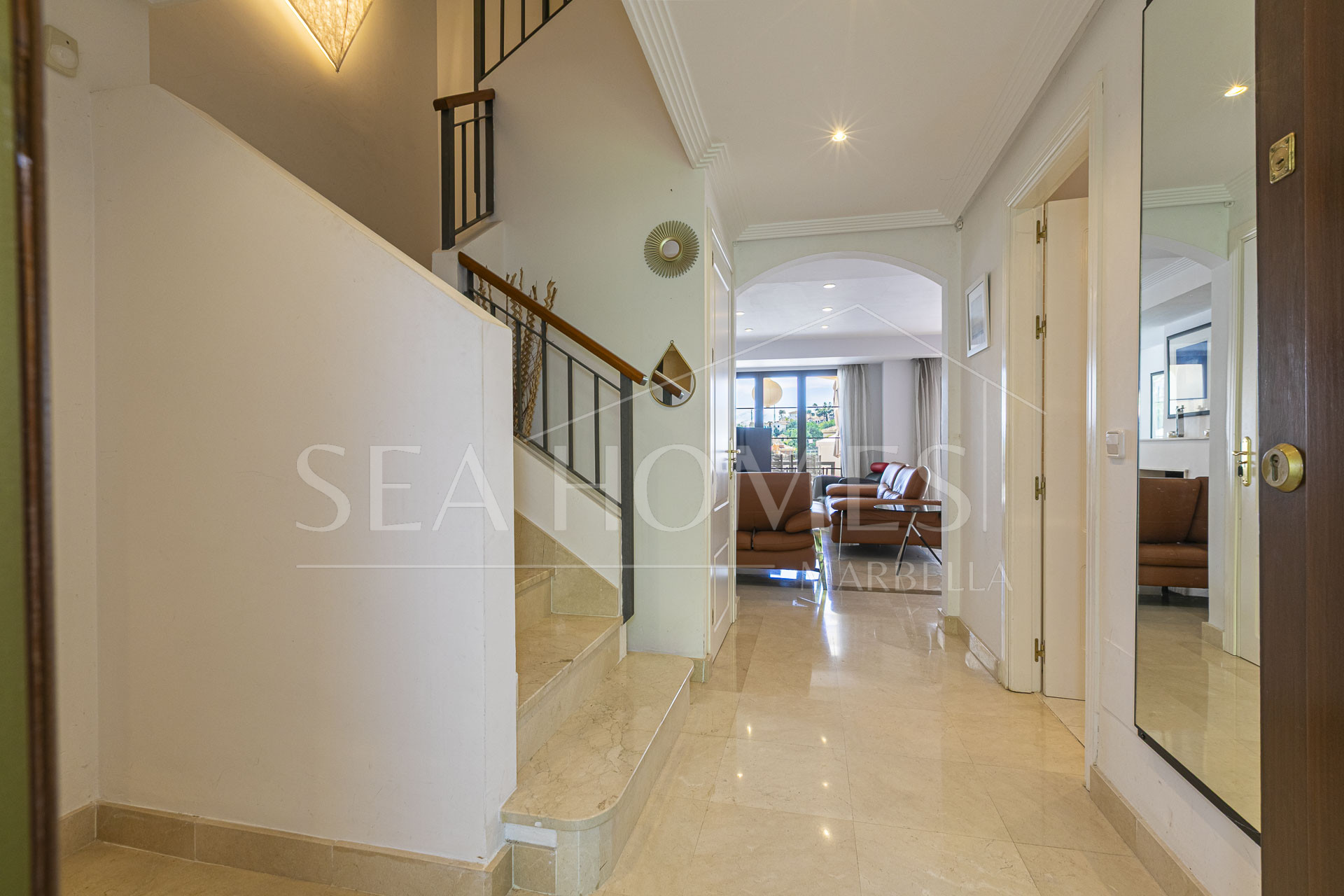 Beautiful south-facing, four bedroom townhouse in Los Almendros, part of the secure Los Arqueros Golf community in Benahavís