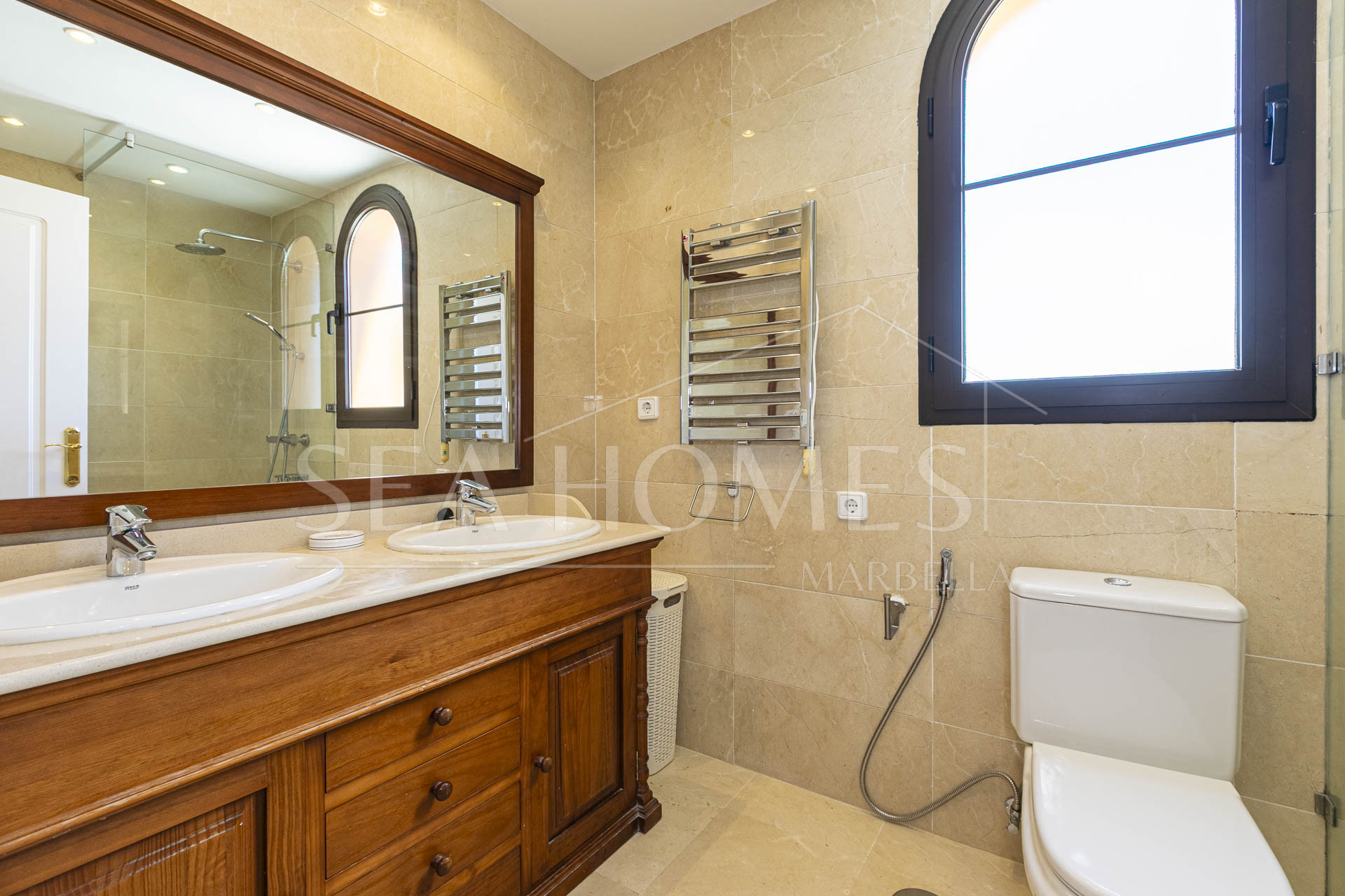 Beautiful south-facing, four bedroom townhouse in Los Almendros, part of the secure Los Arqueros Golf community in Benahavís