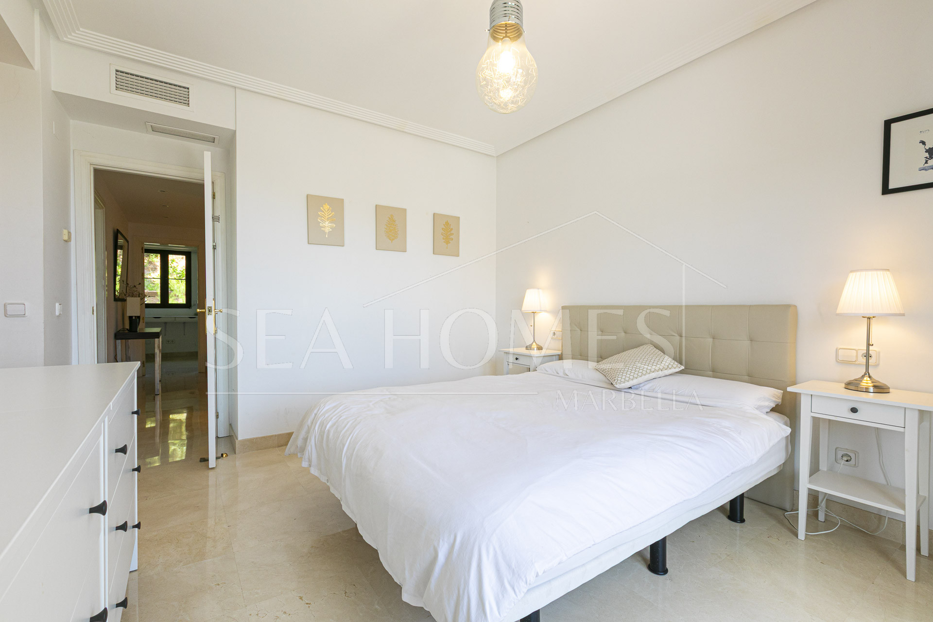 Beautiful south-facing, four bedroom townhouse in Los Almendros, part of the secure Los Arqueros Golf community in Benahavís