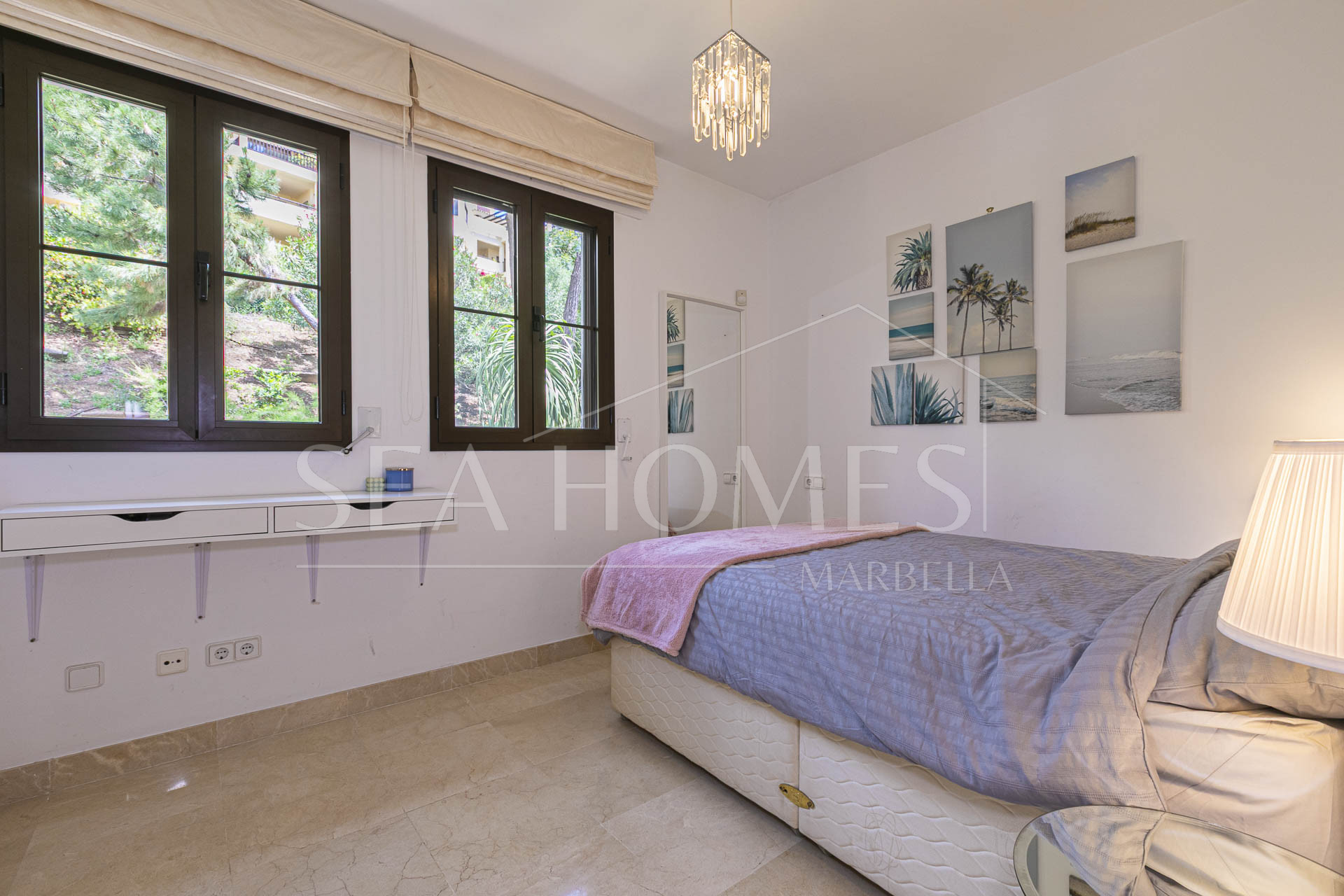 Beautiful south-facing, four bedroom townhouse in Los Almendros, part of the secure Los Arqueros Golf community in Benahavís