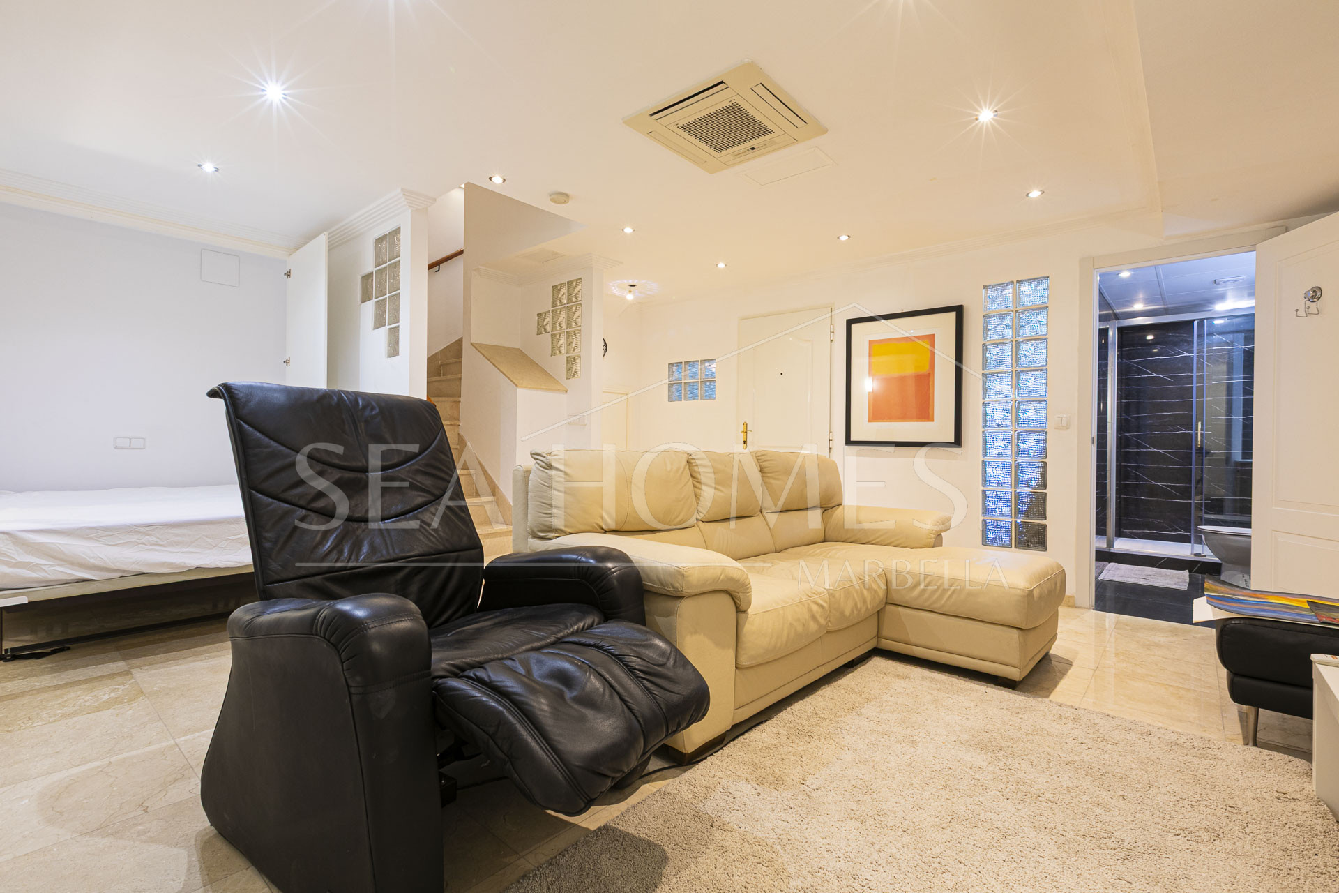 Beautiful south-facing, four bedroom townhouse in Los Almendros, part of the secure Los Arqueros Golf community in Benahavís