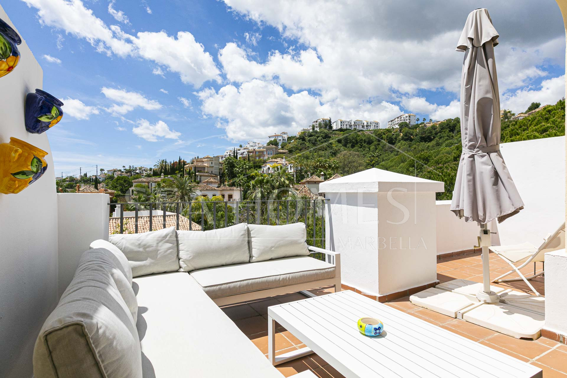 Beautiful south-facing, four bedroom townhouse in Los Almendros, part of the secure Los Arqueros Golf community in Benahavís