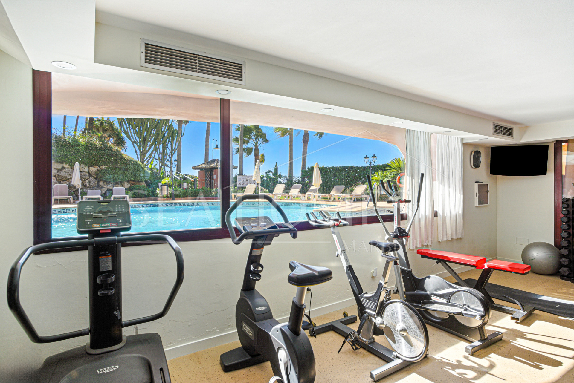 Impeccably renovated, south facing beach front, garden apartment located in the exclusive Menara Beach community on the sought-after New Golden Mile