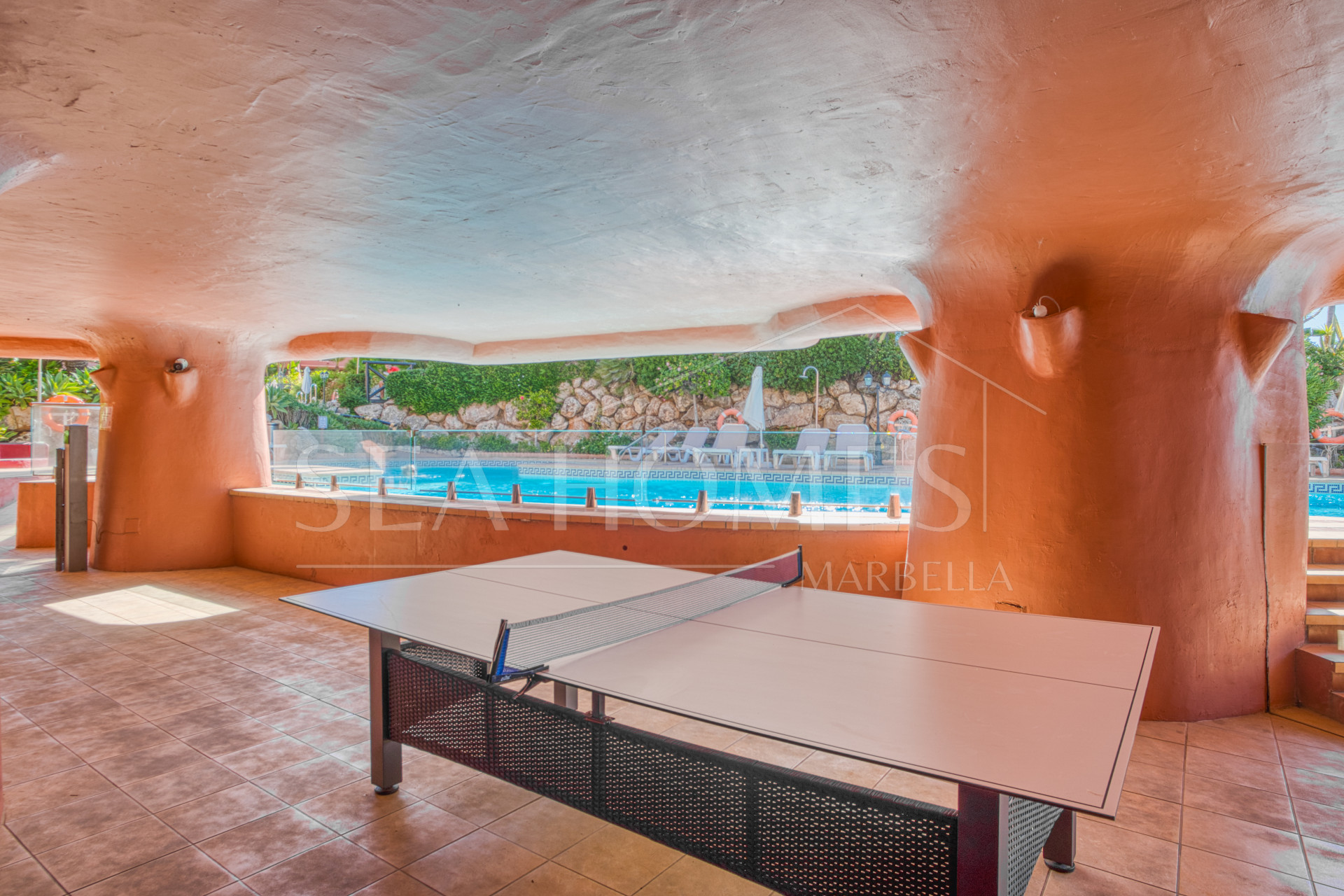 Impeccably renovated, south facing beach front, garden apartment located in the exclusive Menara Beach community on the sought-after New Golden Mile