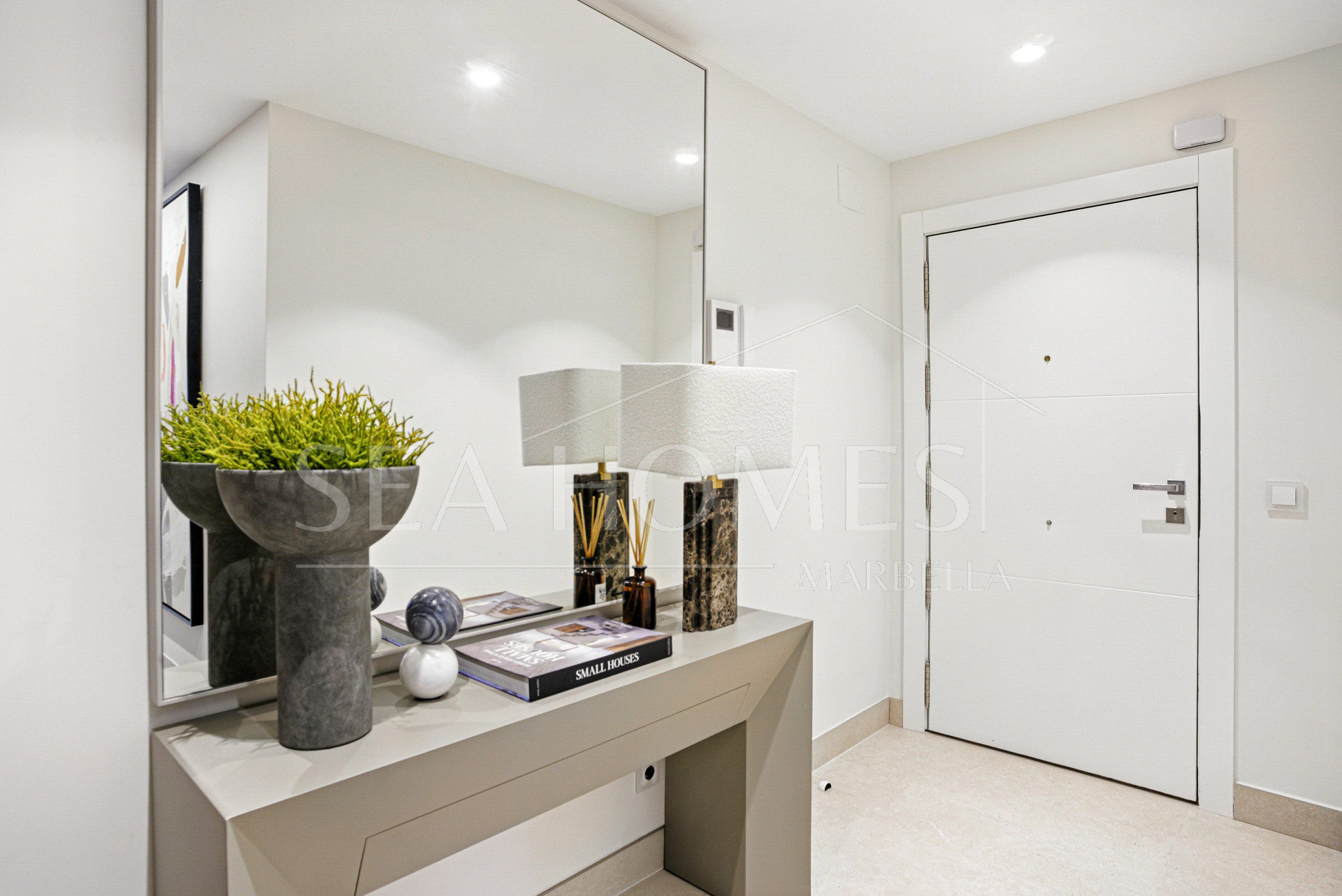 Impeccably renovated, south facing beach front, garden apartment located in the exclusive Menara Beach community on the sought-after New Golden Mile