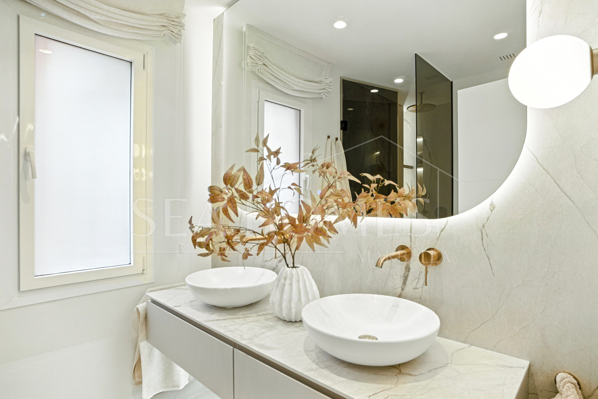 Impeccably renovated, south facing beach front, garden apartment located in the exclusive Menara Beach community on the sought-after New Golden Mile