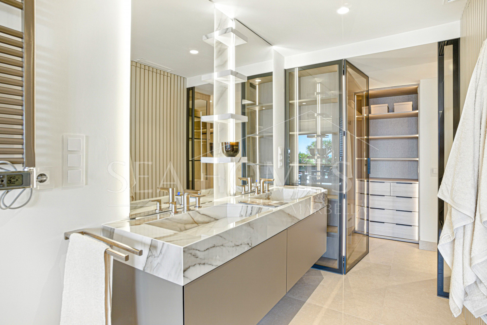 Impeccably renovated, south facing beach front, garden apartment located in the exclusive Menara Beach community on the sought-after New Golden Mile