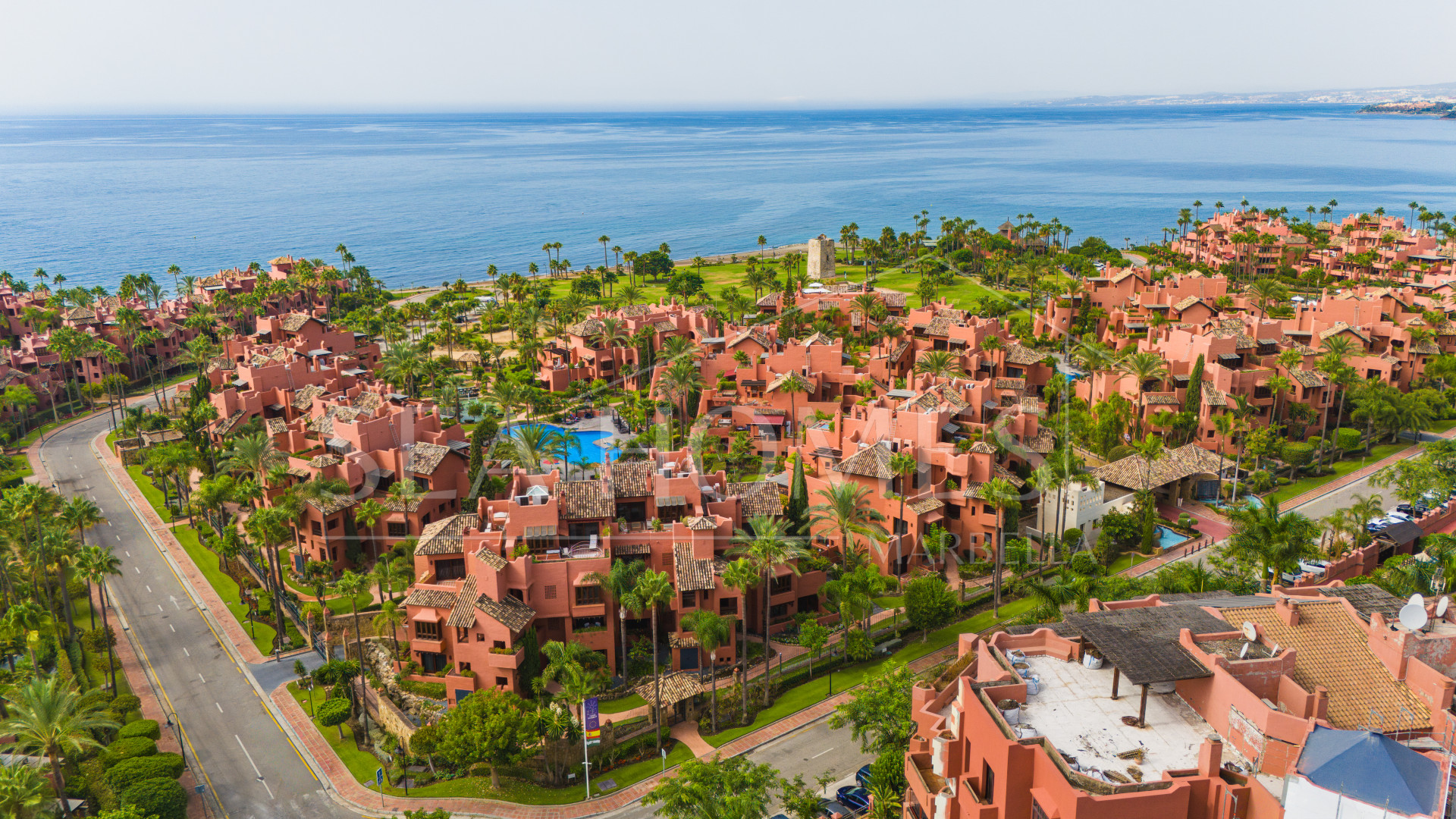 Impeccably renovated, south facing beach front, garden apartment located in the exclusive Menara Beach community on the sought-after New Golden Mile