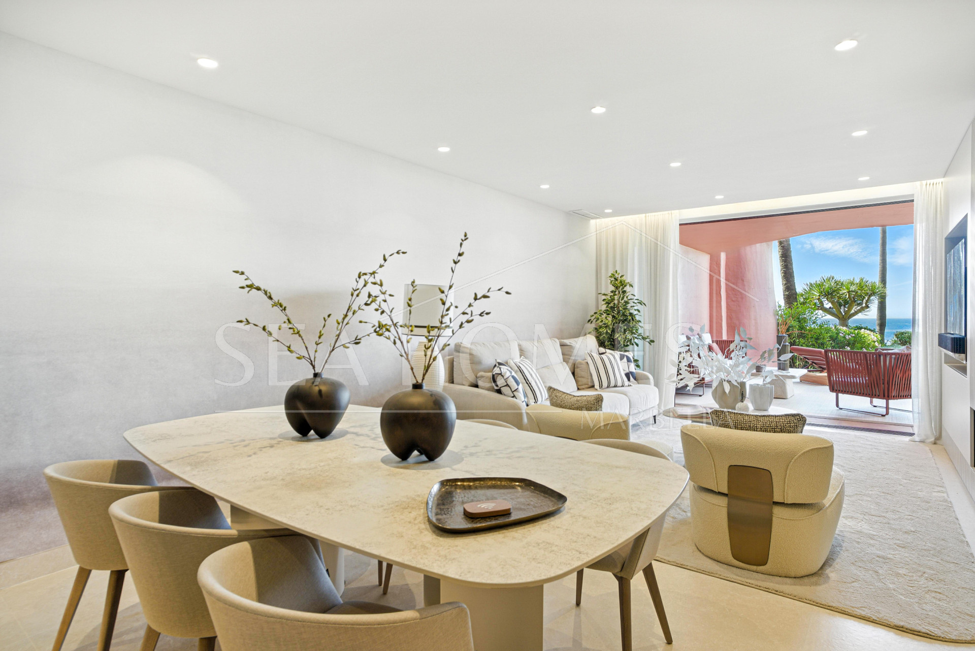 Impeccably renovated, south facing beach front, garden apartment located in the exclusive Menara Beach community on the sought-after New Golden Mile