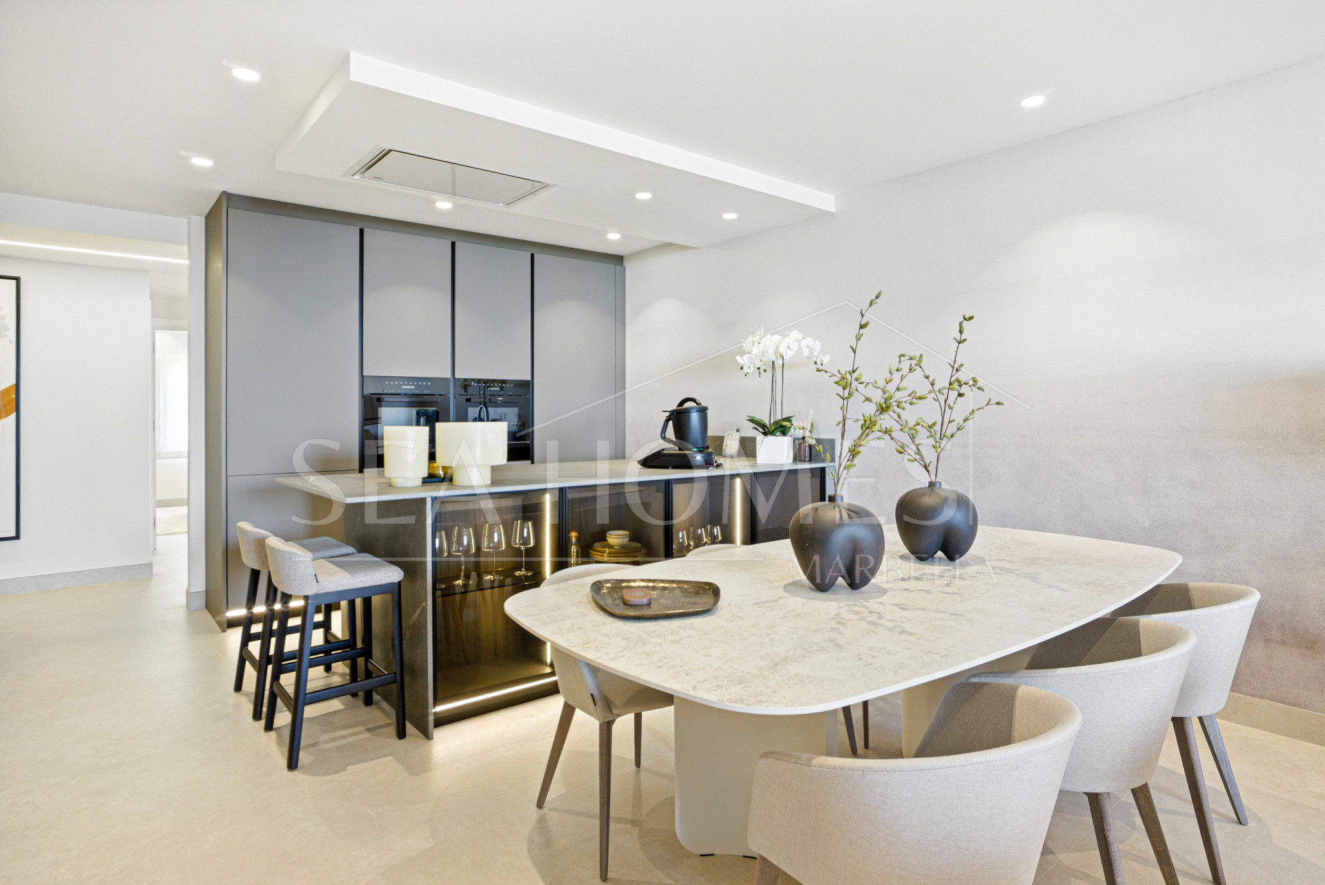 Impeccably renovated, south facing beach front, garden apartment located in the exclusive Menara Beach community on the sought-after New Golden Mile