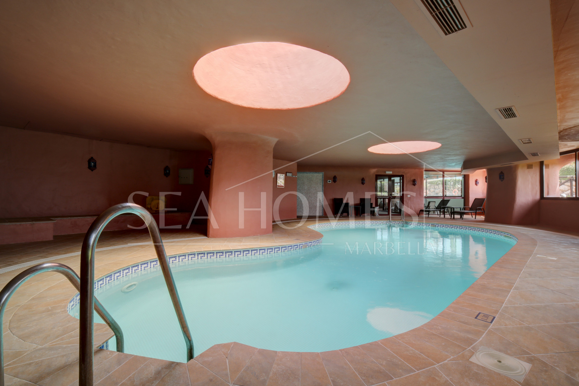 Impeccably renovated, south facing beach front, garden apartment located in the exclusive Menara Beach community on the sought-after New Golden Mile