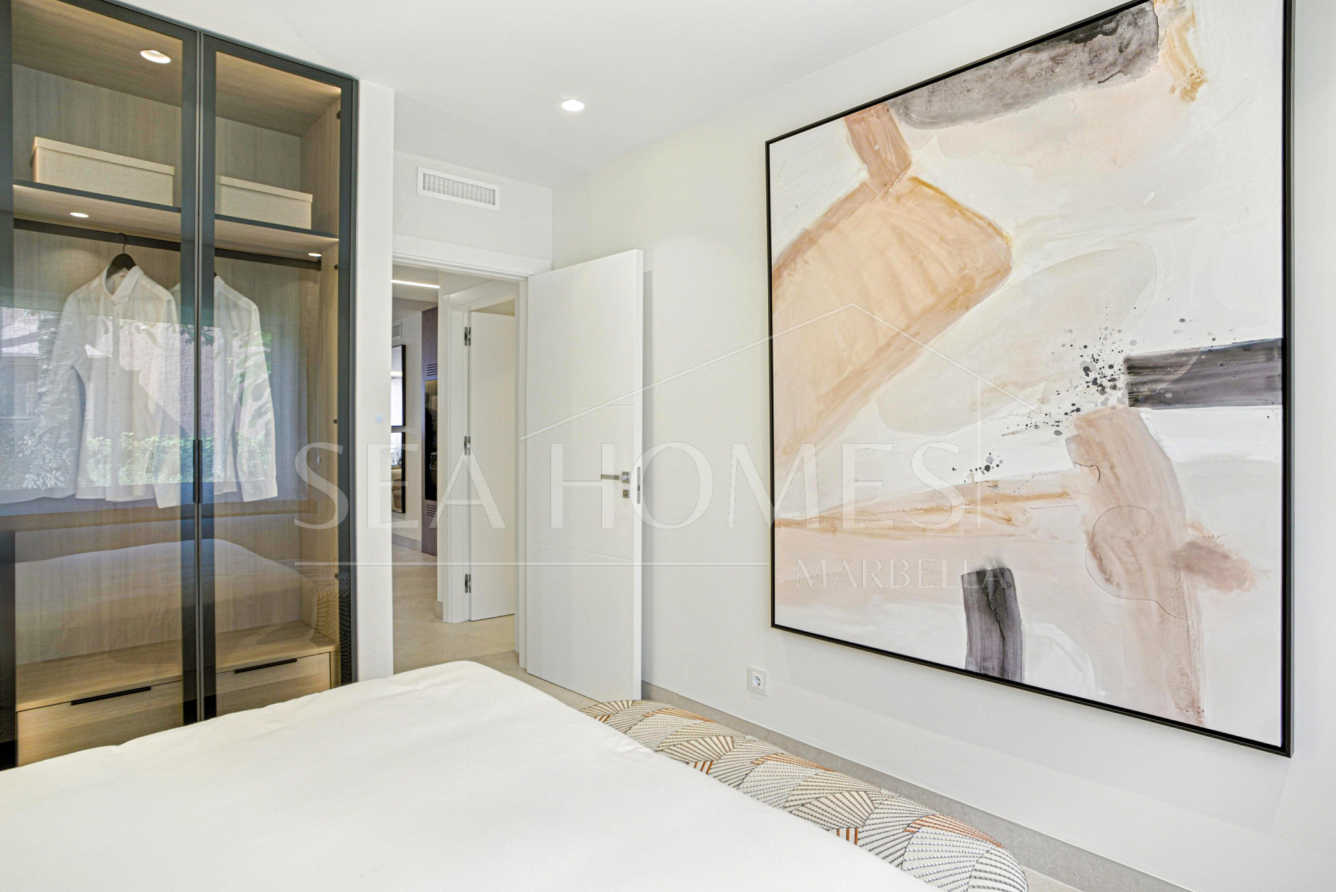 Impeccably renovated, south facing beach front, garden apartment located in the exclusive Menara Beach community on the sought-after New Golden Mile