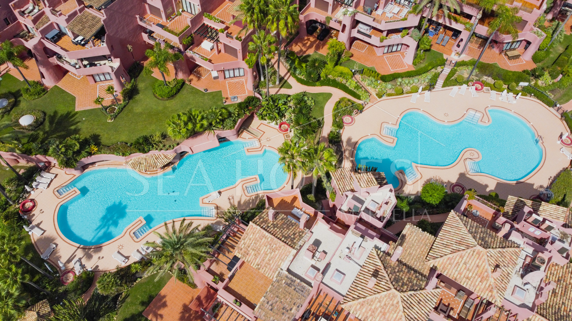 Impeccably renovated, south facing beach front, garden apartment located in the exclusive Menara Beach community on the sought-after New Golden Mile