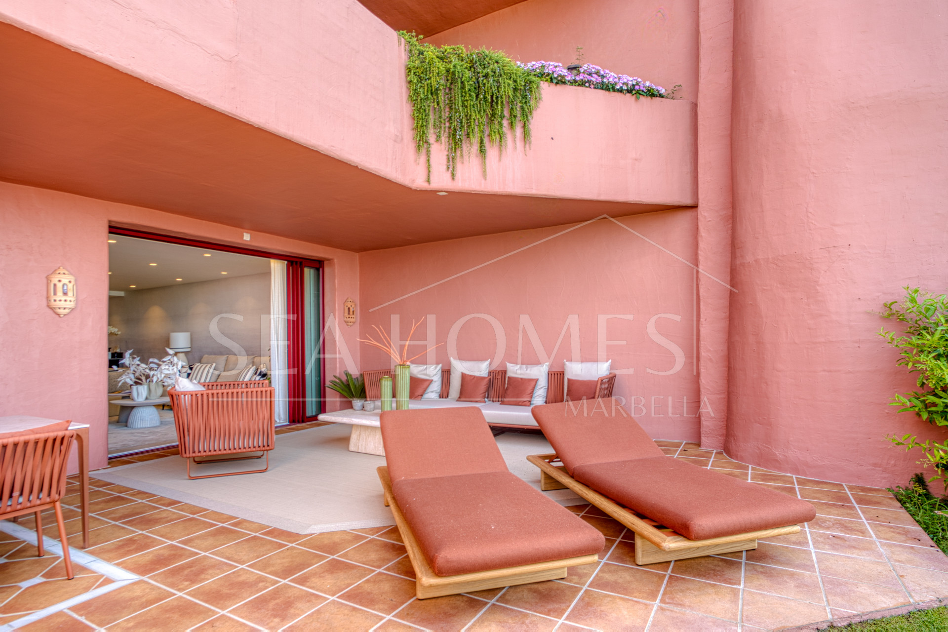 Impeccably renovated, south facing beach front, garden apartment located in the exclusive Menara Beach community on the sought-after New Golden Mile