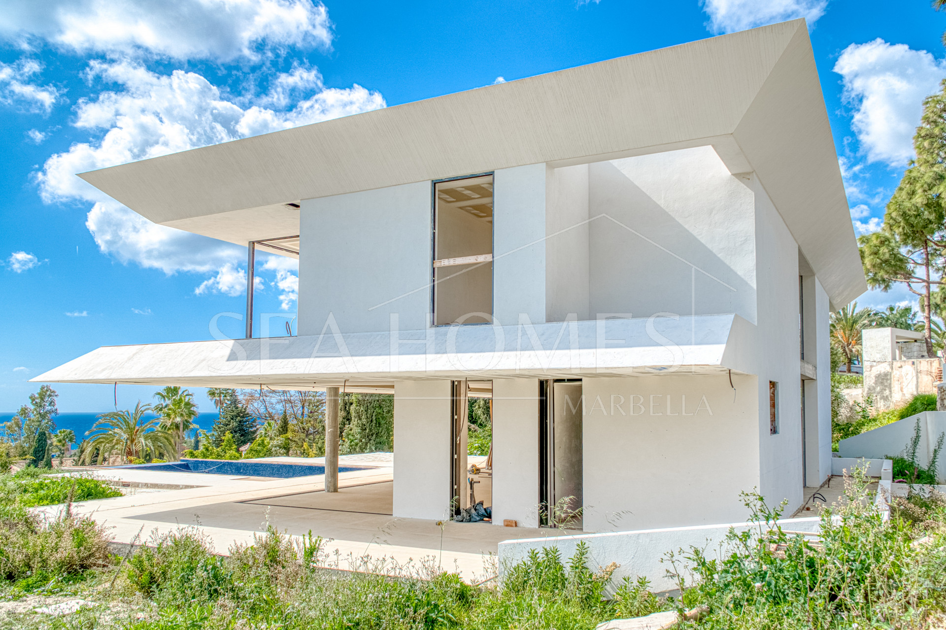 Experience unparalleled luxury with this soon-to-be-completed turnkey villa in the prestigious Hacienda Las Chapas