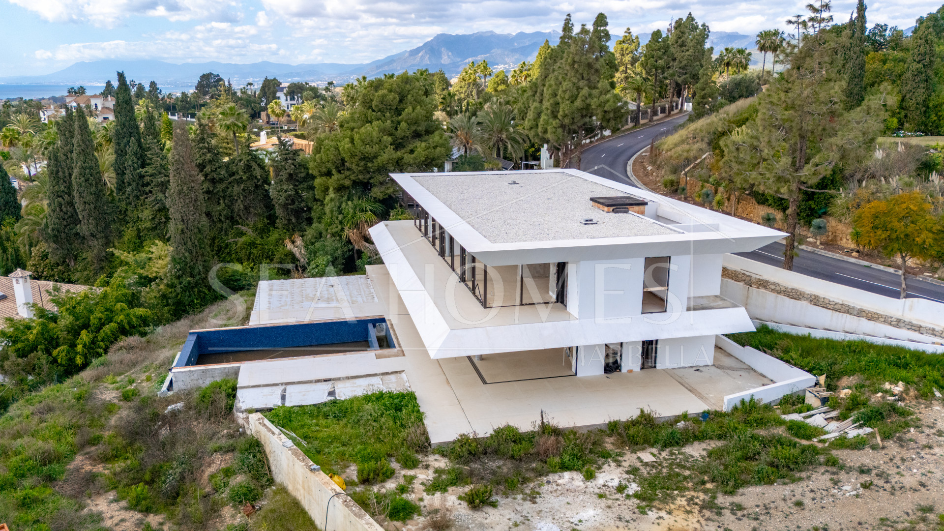Experience unparalleled luxury with this soon-to-be-completed turnkey villa in the prestigious Hacienda Las Chapas