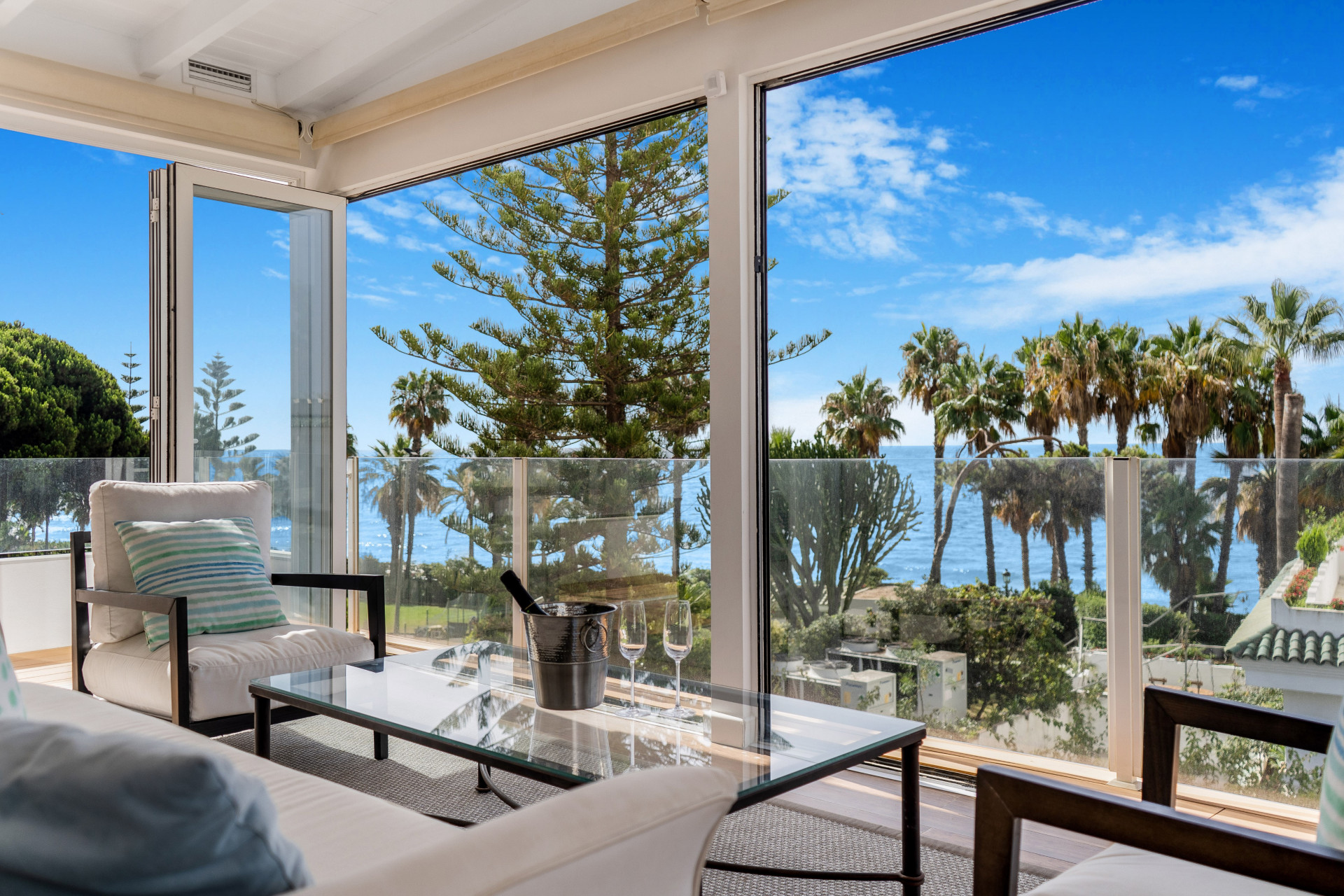 Beautiful frontline beach, four-bedroom end townhouse in the prestigious community of Marbellamar, on Marbella Golden Mile