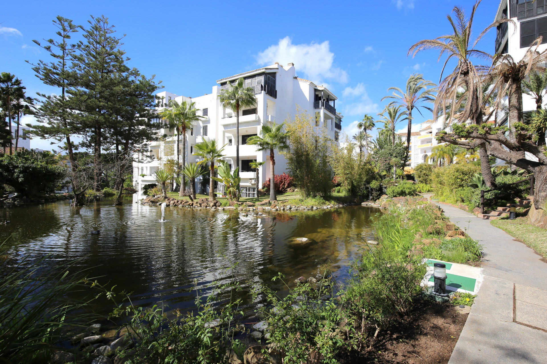 Beautiful south facing, two bedroom apartment located within the beachfront community of Jardines de las Golondrinas, Elviria