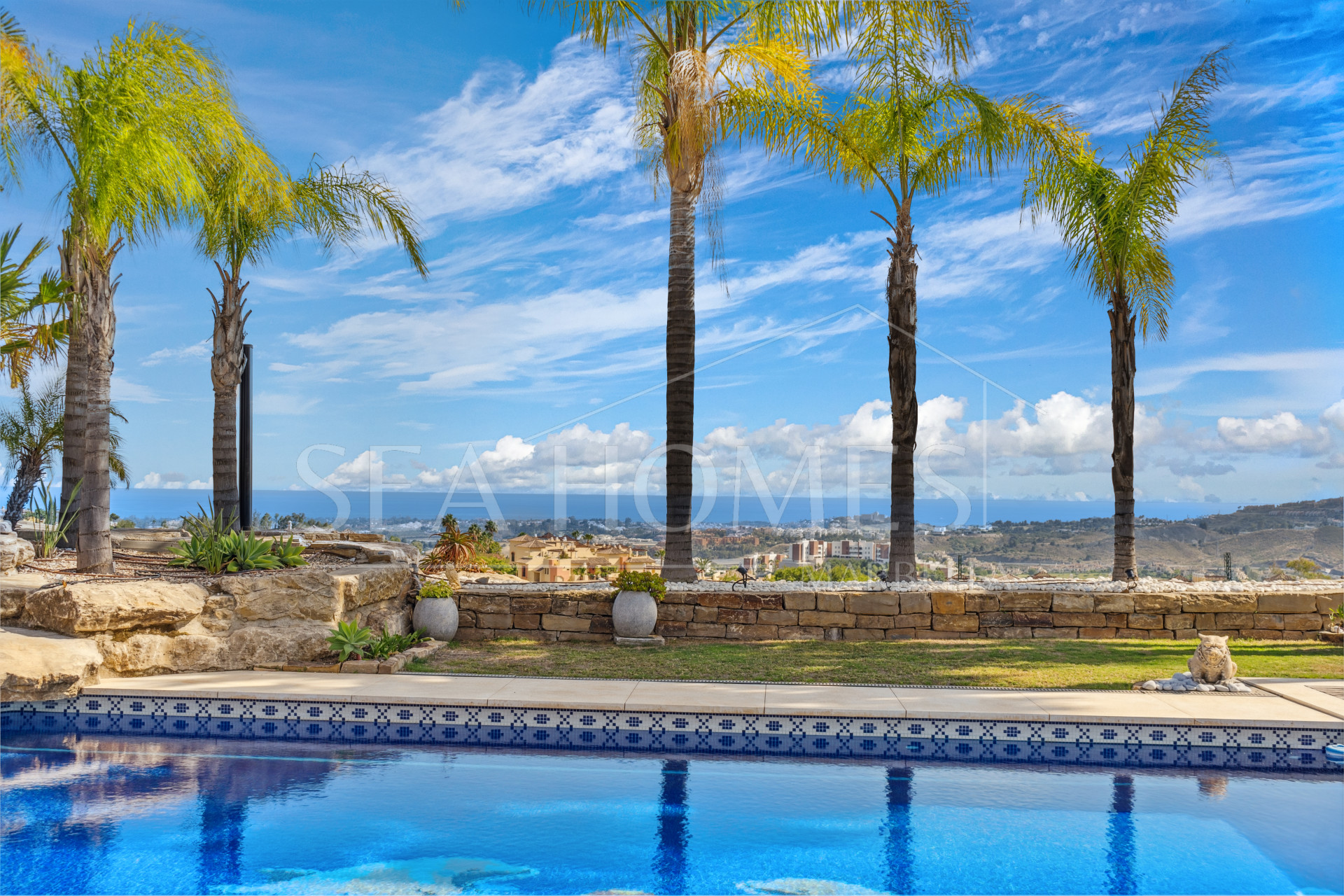 Impressive four-bedroom frontline golf villa in Los Arqueros, Benahavis with sea and mountain views