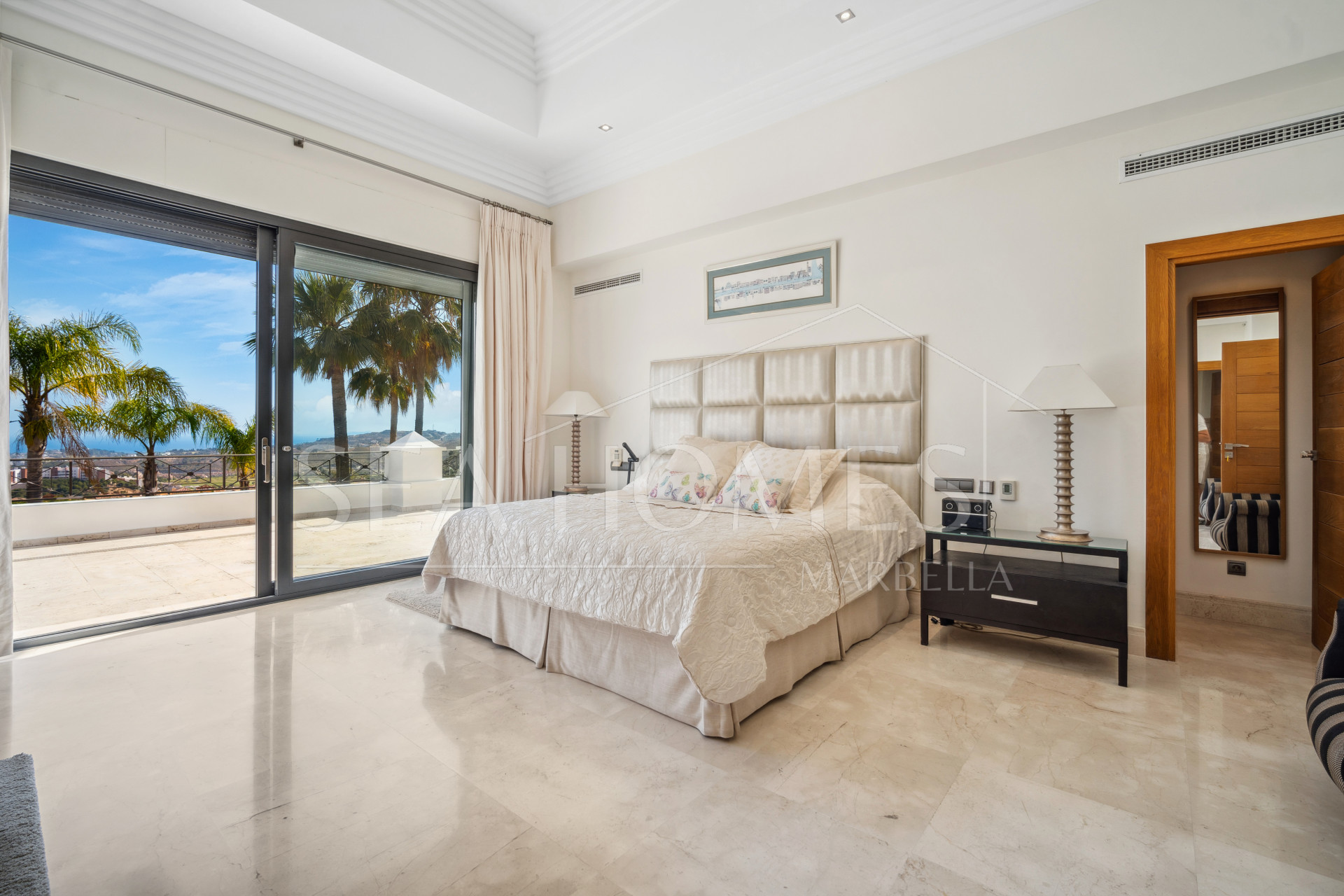 Impressive four-bedroom frontline golf villa in Los Arqueros, Benahavis with sea and mountain views