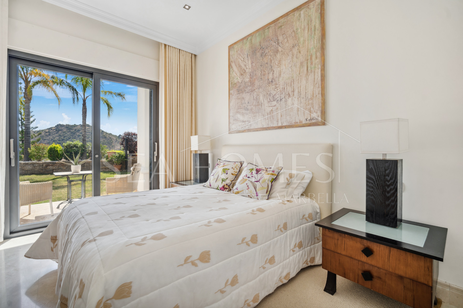 Impressive four-bedroom frontline golf villa in Los Arqueros, Benahavis with sea and mountain views