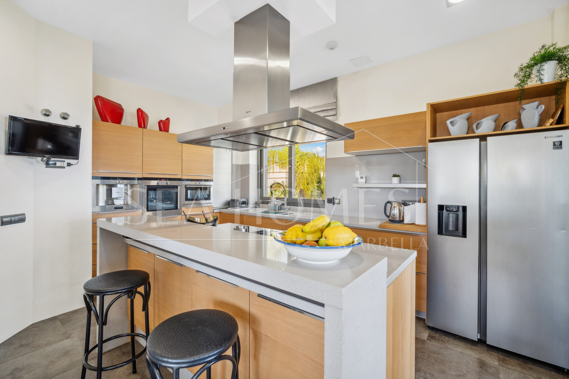 Impressive four-bedroom frontline golf villa in Los Arqueros, Benahavis with sea and mountain views