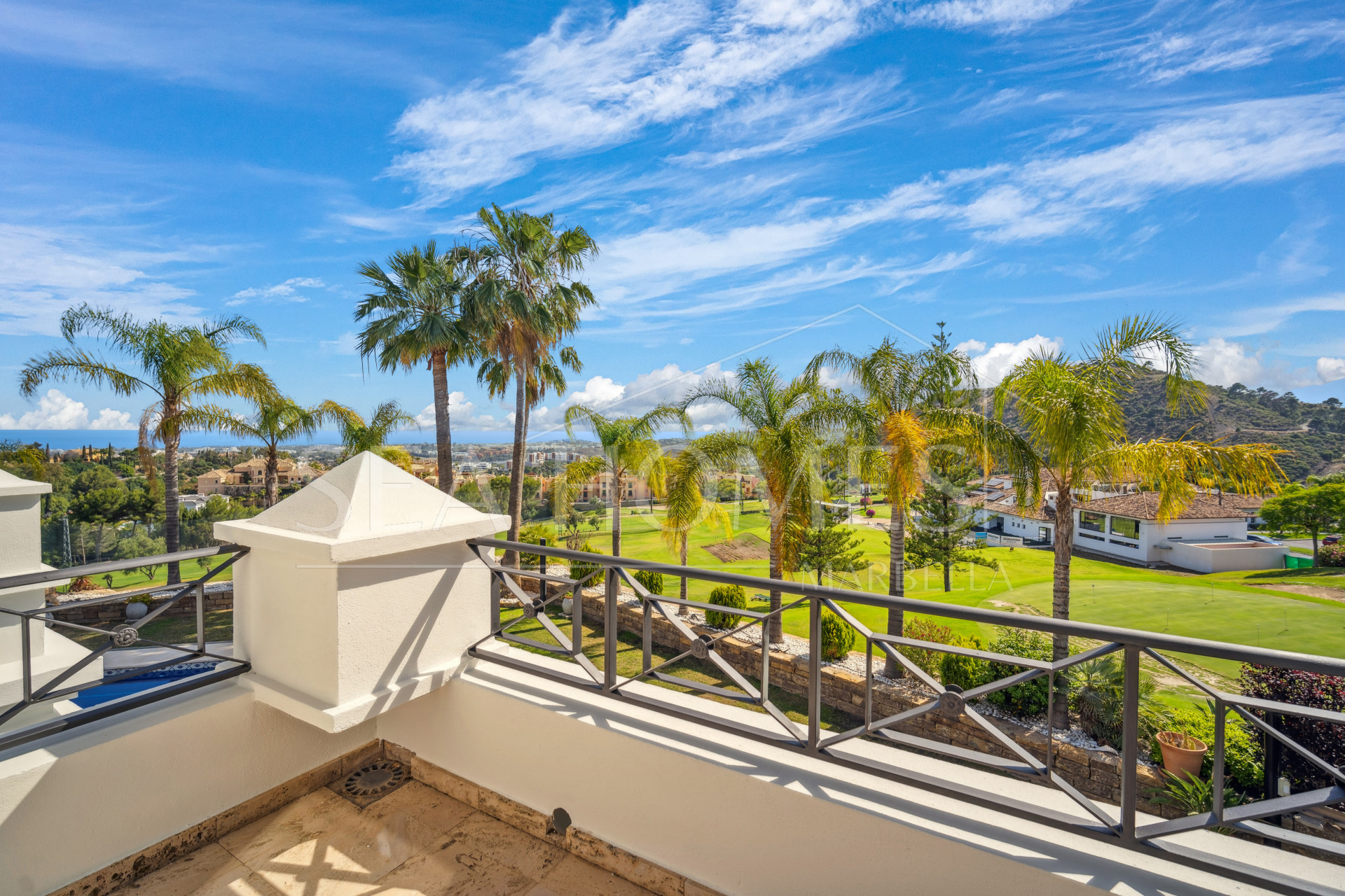Impressive four-bedroom frontline golf villa in Los Arqueros, Benahavis with sea and mountain views