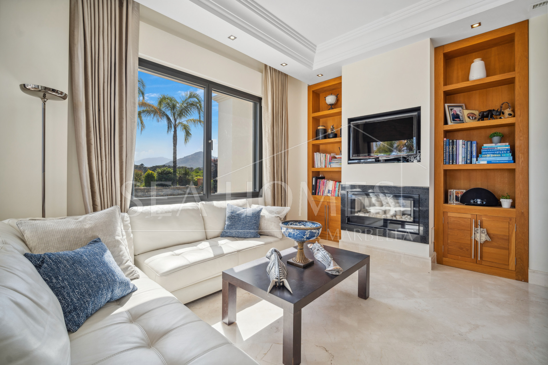 Impressive four-bedroom frontline golf villa in Los Arqueros, Benahavis with sea and mountain views