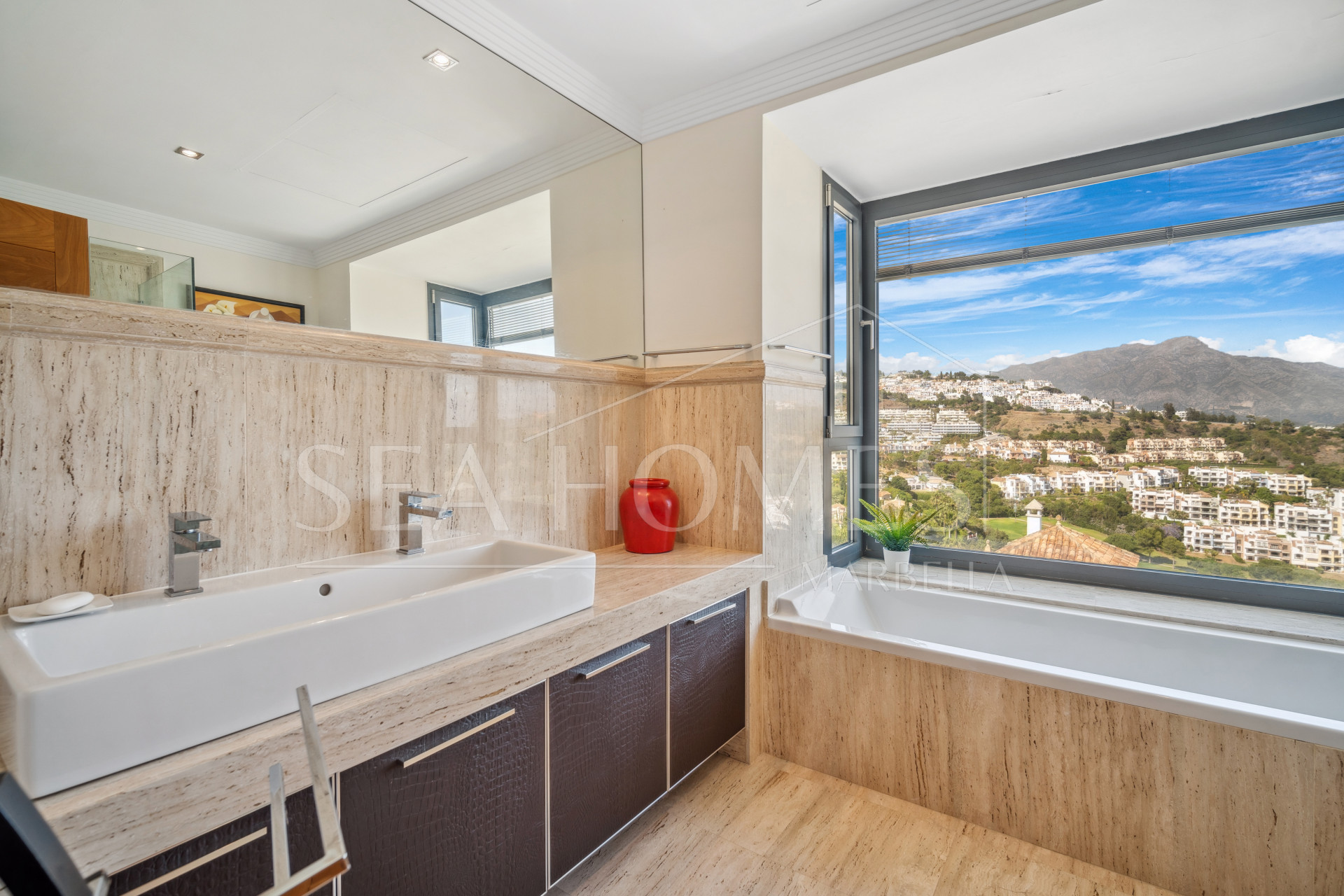 Impressive four-bedroom frontline golf villa in Los Arqueros, Benahavis with sea and mountain views