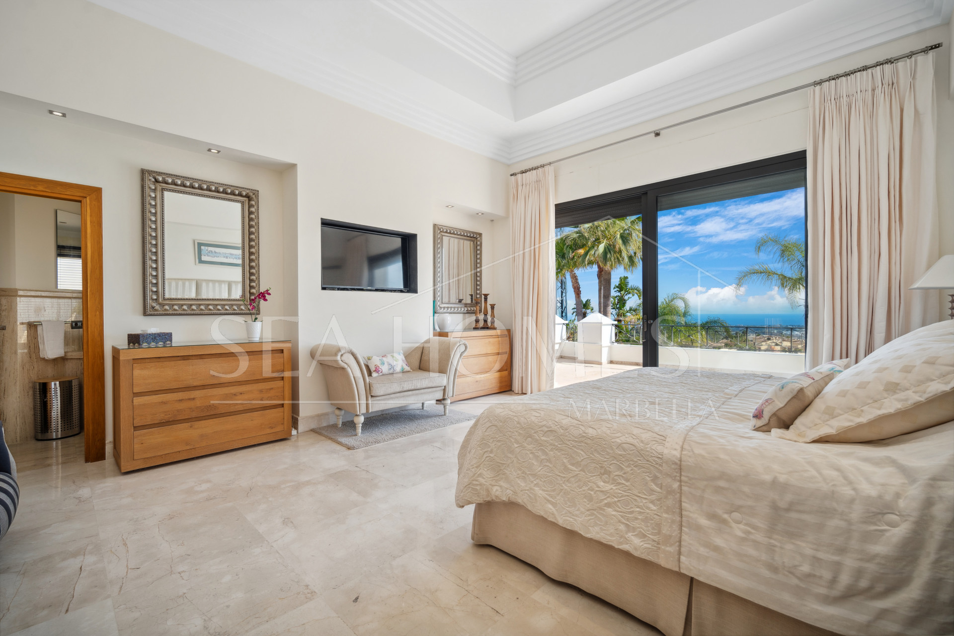 Impressive four-bedroom frontline golf villa in Los Arqueros, Benahavis with sea and mountain views