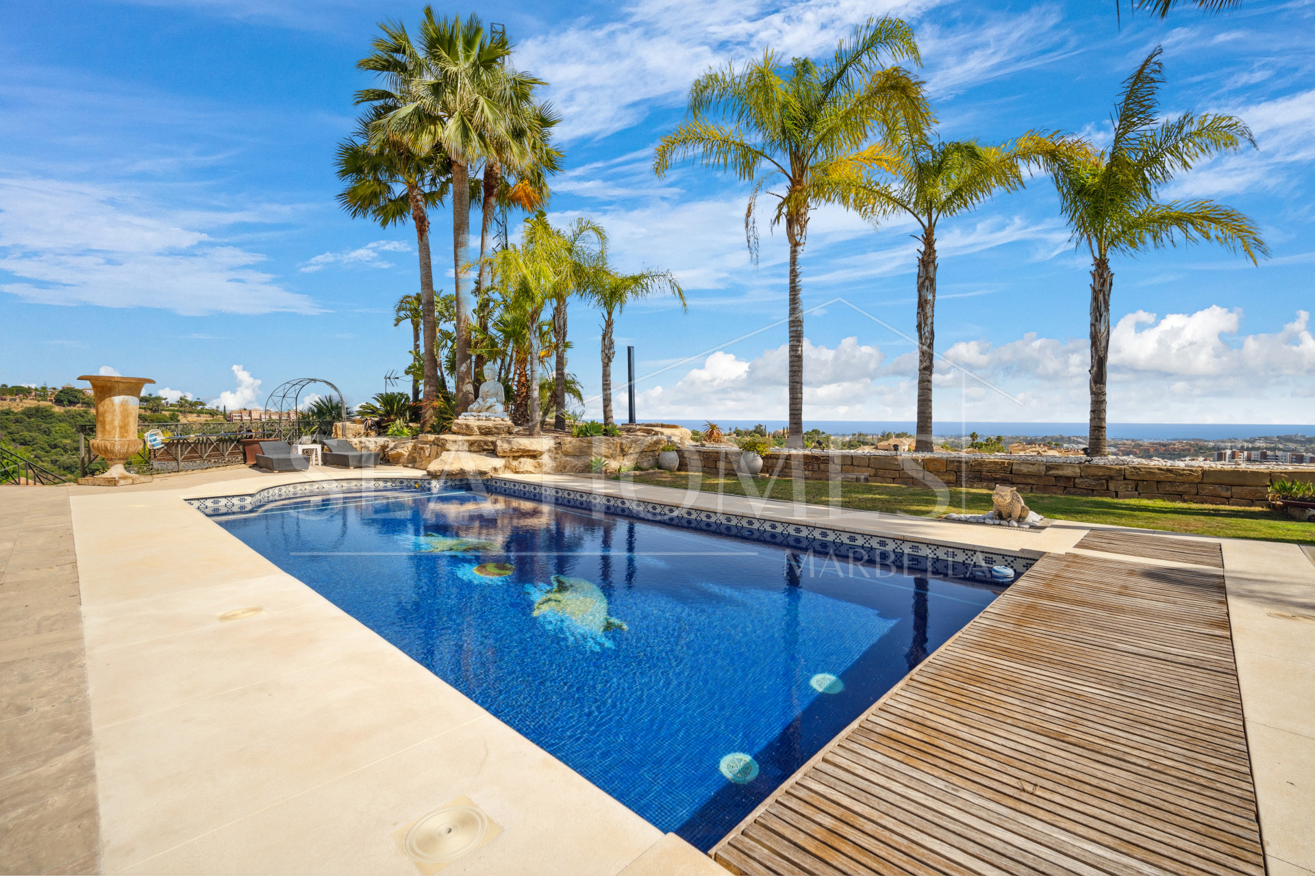 Impressive four-bedroom frontline golf villa in Los Arqueros, Benahavis with sea and mountain views