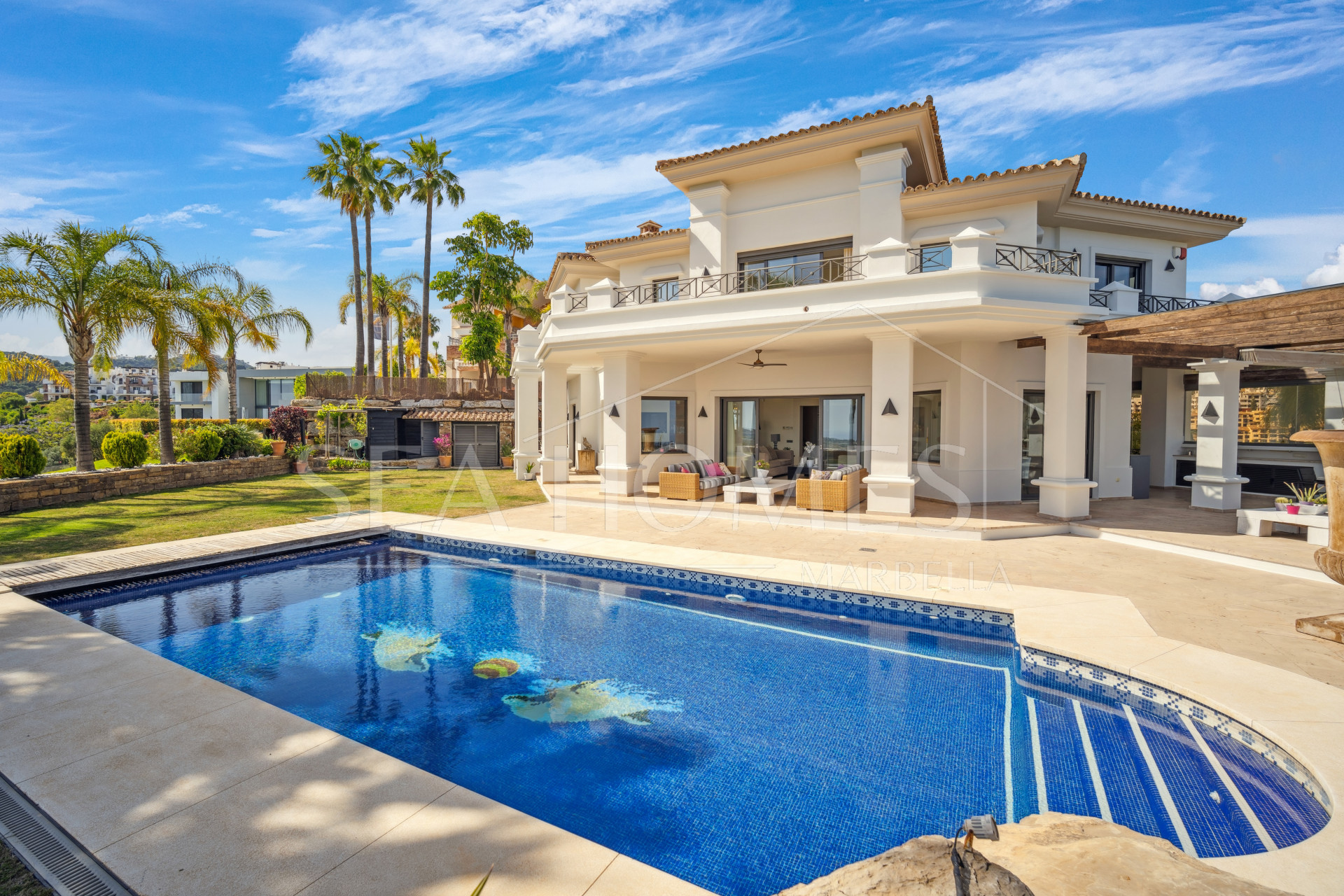Impressive four-bedroom frontline golf villa in Los Arqueros, Benahavis with sea and mountain views