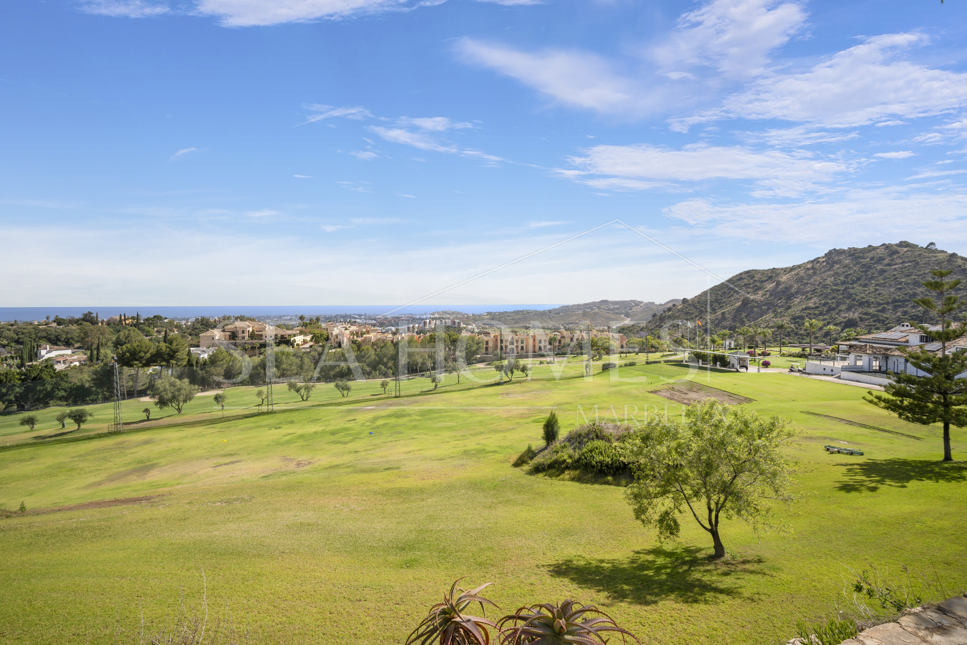 Impressive four-bedroom frontline golf villa in Los Arqueros, Benahavis with sea and mountain views