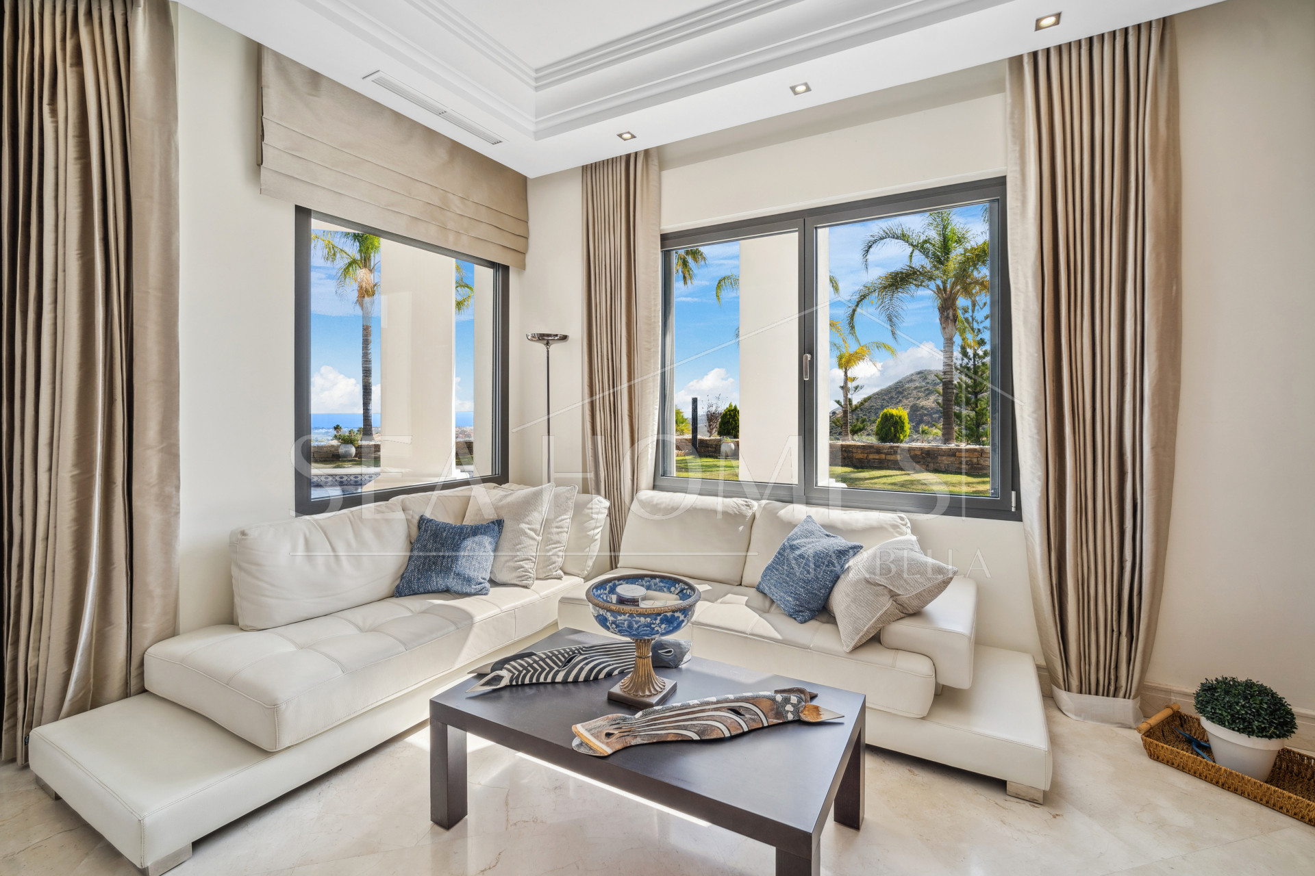 Impressive four-bedroom frontline golf villa in Los Arqueros, Benahavis with sea and mountain views