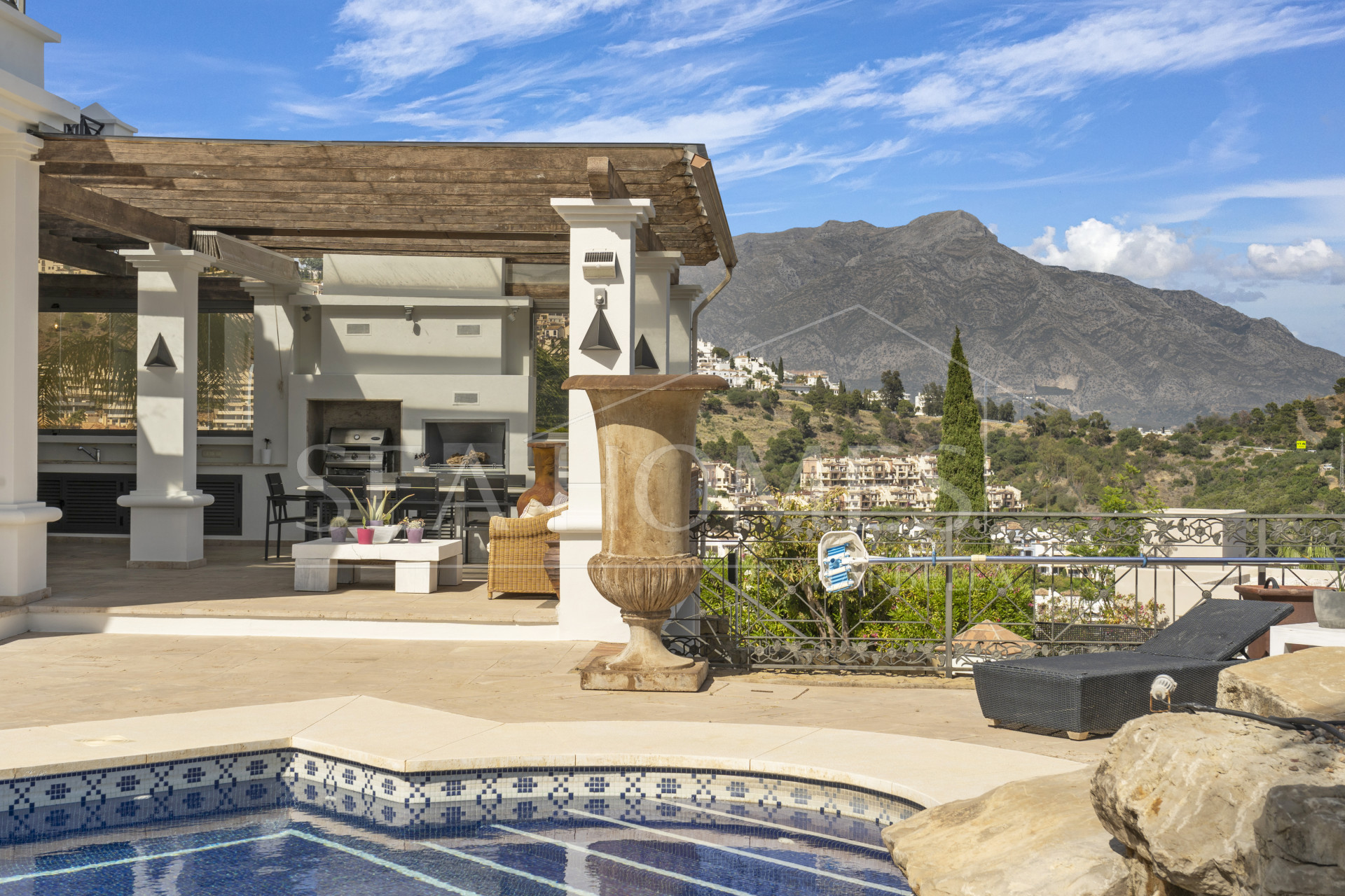 Impressive four-bedroom frontline golf villa in Los Arqueros, Benahavis with sea and mountain views