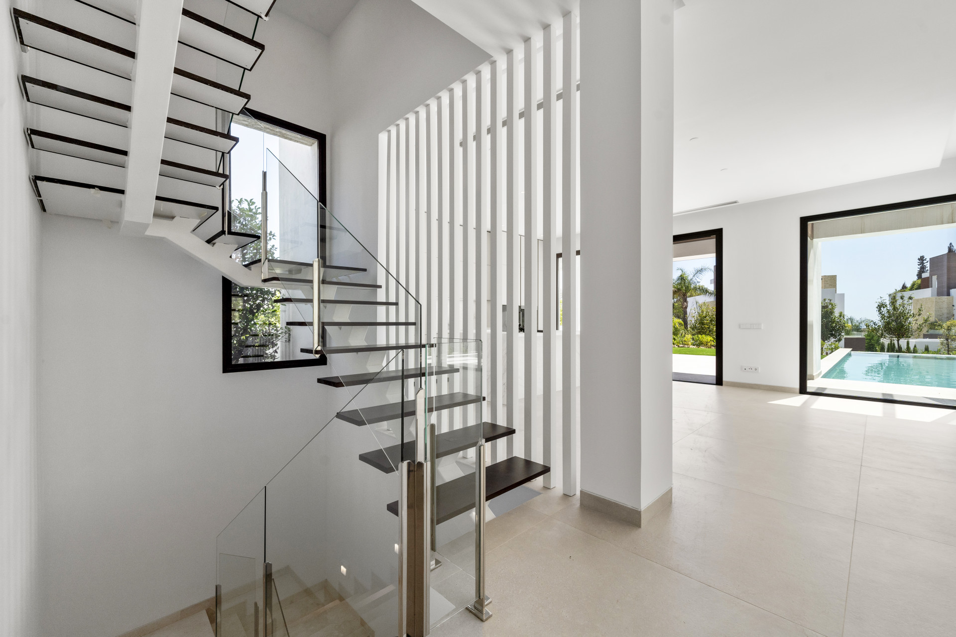 Deluxe modern four bedroom, south facing villa nestled within a luxury gated community on Marbellas Golden Mile.