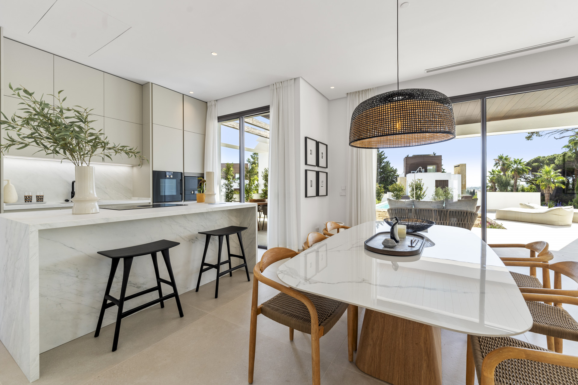 Deluxe modern four bedroom, south facing villa nestled within a luxury gated community on Marbella's Golden Mile.