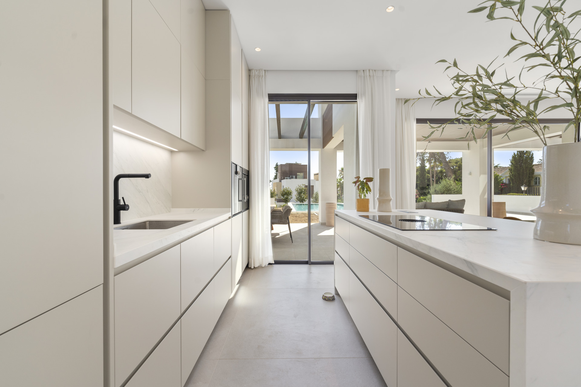 Deluxe modern four bedroom, south facing villa nestled within a luxury gated community on Marbella's Golden Mile.