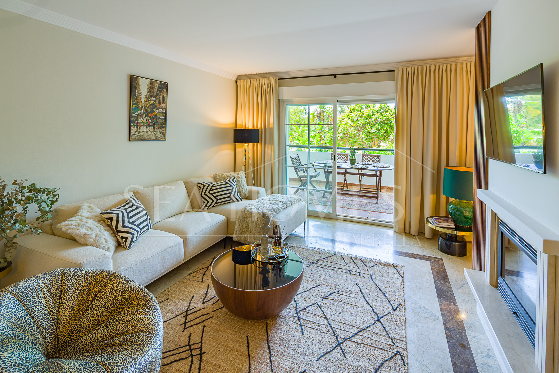 Stunning two bedroom south west facing elevated ground floor apartment in the heart of Marbella's Golden Mile